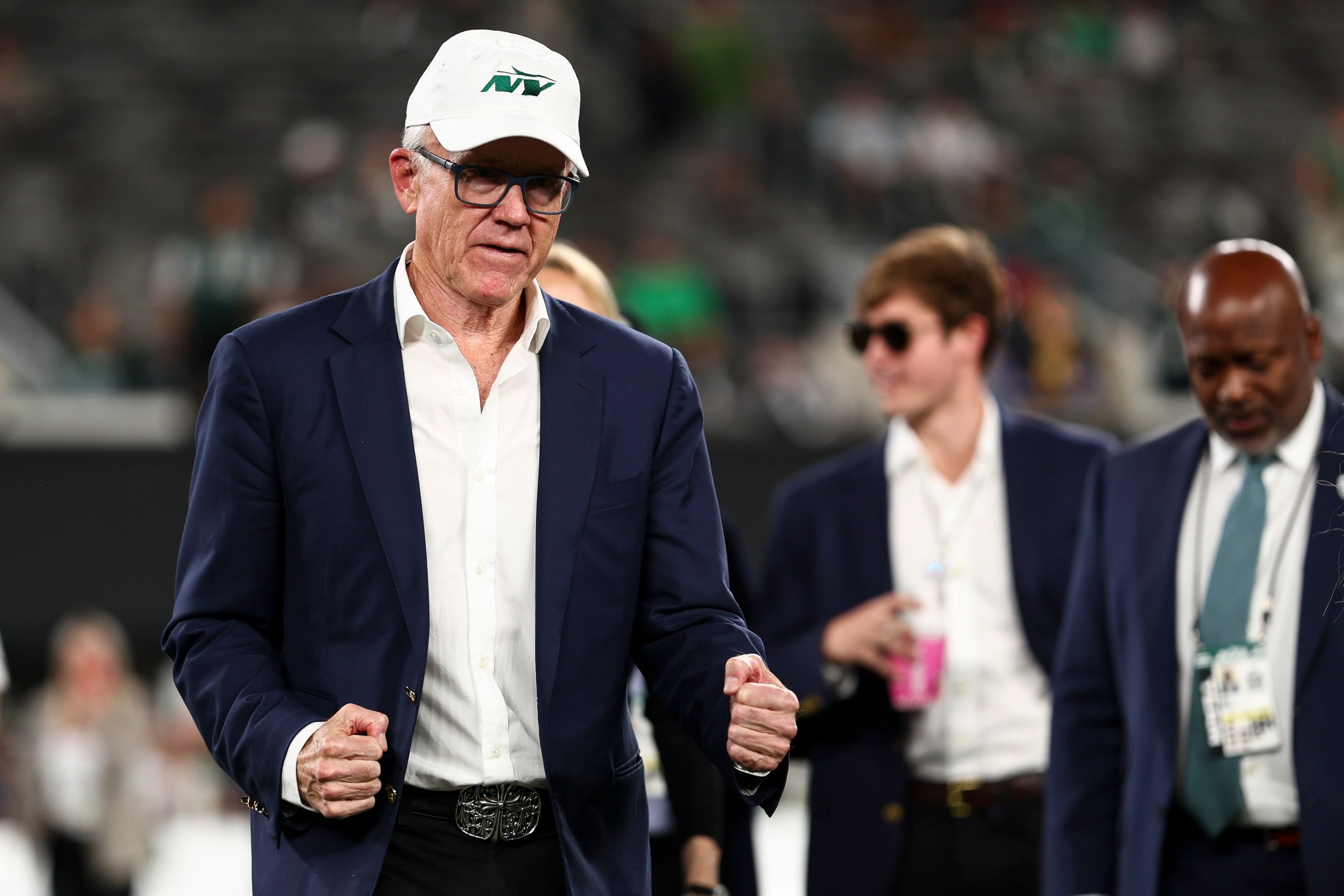 New York Jets owner Woody Johnson stands on the field prior to an NFL football game against the Houston Texans, Thursday at MetLife Stadium on October 31, 2024.