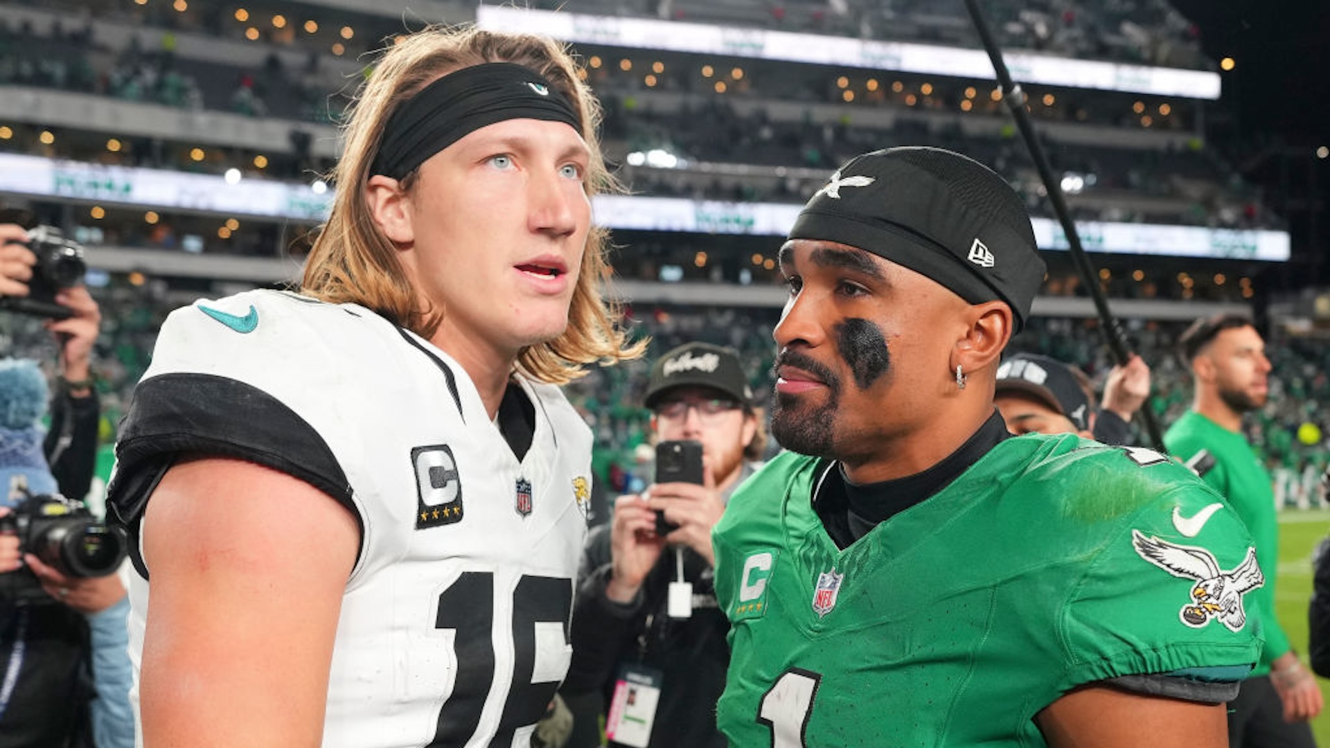 PHILADELPHIA, PENNSYLVANIA - NOVEMBER 3: Trevor Lawrence #16 of the Jacksonville Jaguars talks to Jalen Hurts #1 of the Philadelphia Eagles after the game at Lincoln Financial Field on November 3, 2024 in Philadelphia, Pennsylvania.