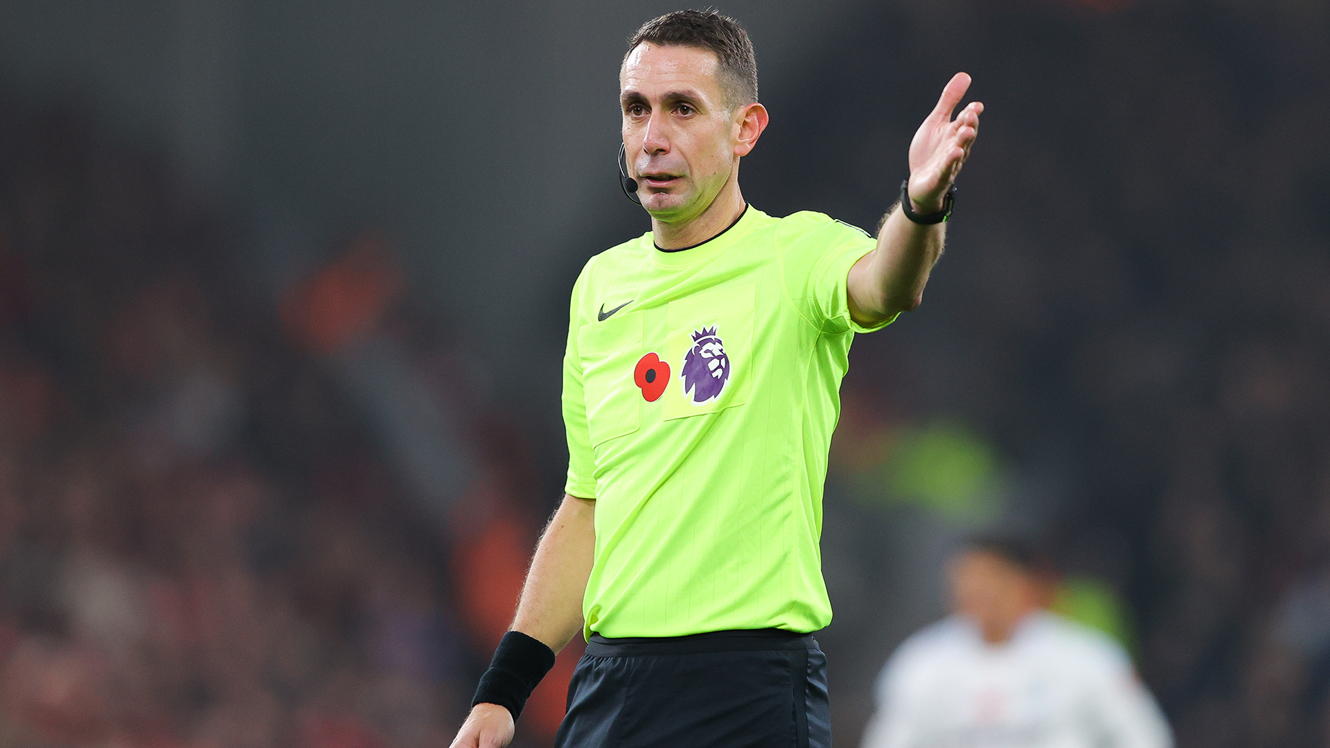 Referee David Coote gestures during the Premier League match between Liverpool FC and Aston Villa FC at Anfield on November 09, 2024 in Liverpool, England.