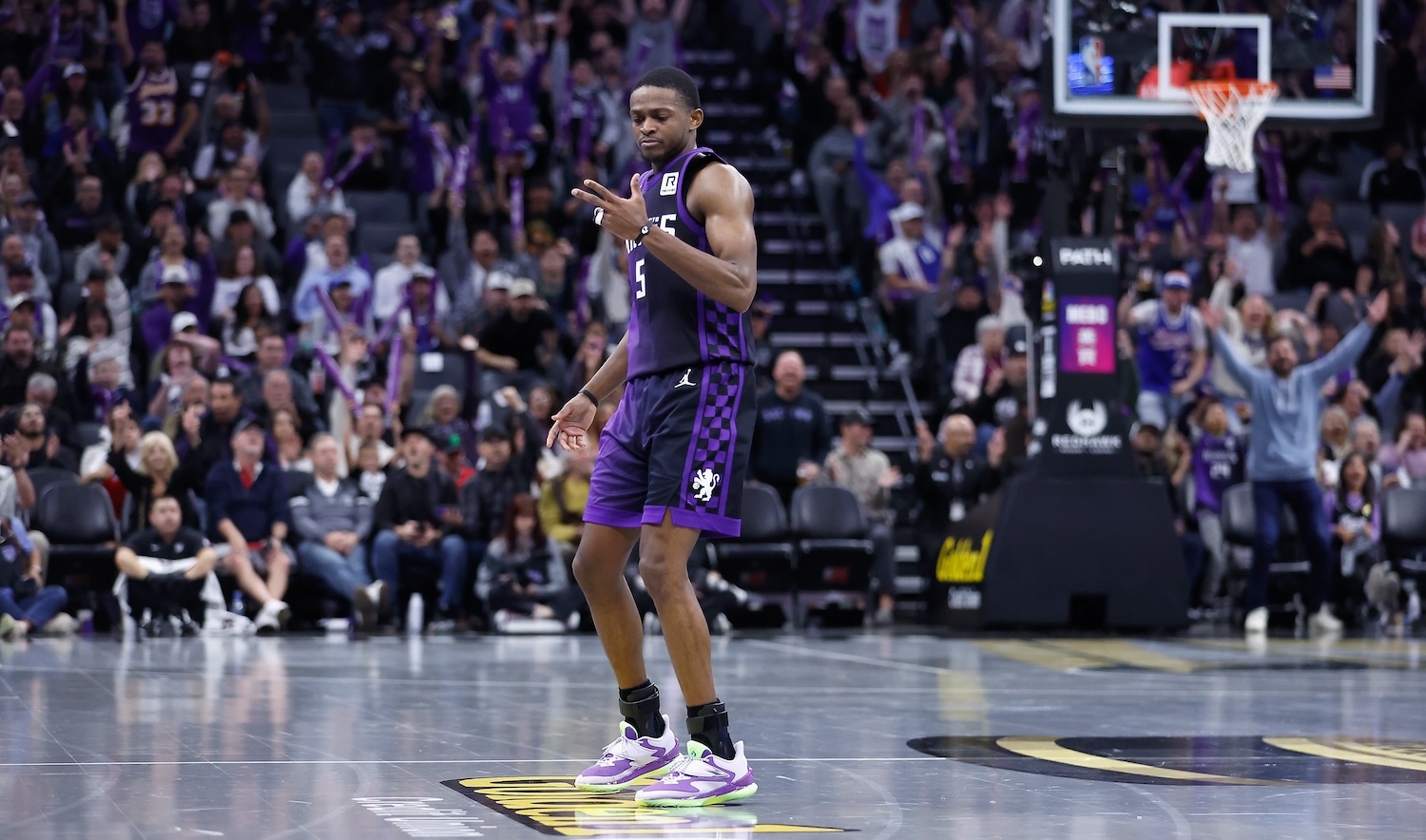 SACRAMENTO, CALIFORNIA - NOVEMBER 15: De'Aaron Fox #5 of the Sacramento Kings reacts after making a three-point basket in overtime against the Minnesota Timberwolves during the Emirates NBA Cup game at Golden 1 Center on November 15, 2024 in Sacramento, California.