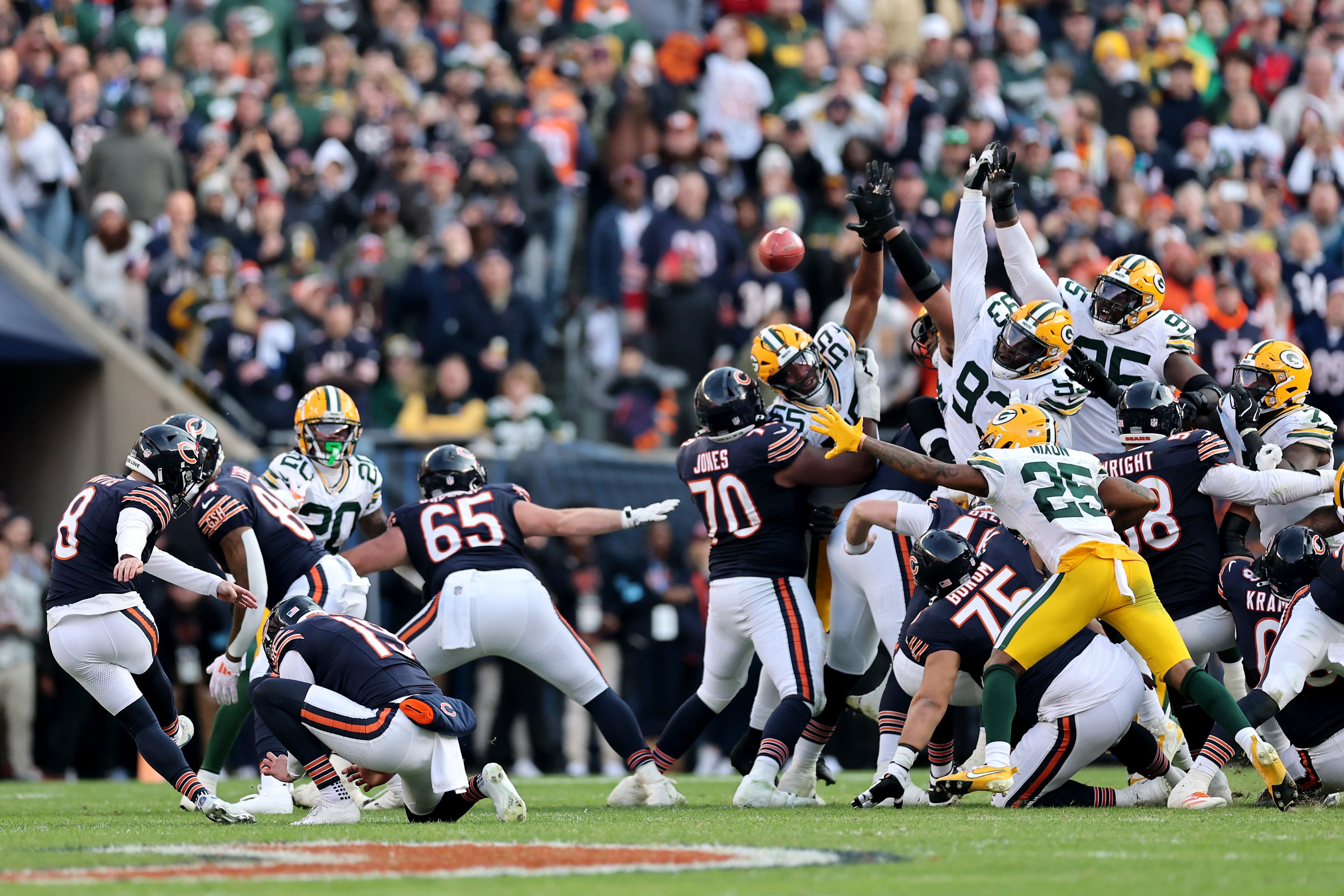 Cairo Santos #8 of the Chicago Bears watches as Karl Brooks #94 of the Green Bay Packers blocks a potential game winning field goal at the end of the fourth quarter of a game at Soldier Field on November 17, 2024 in Chicago, Illinois.