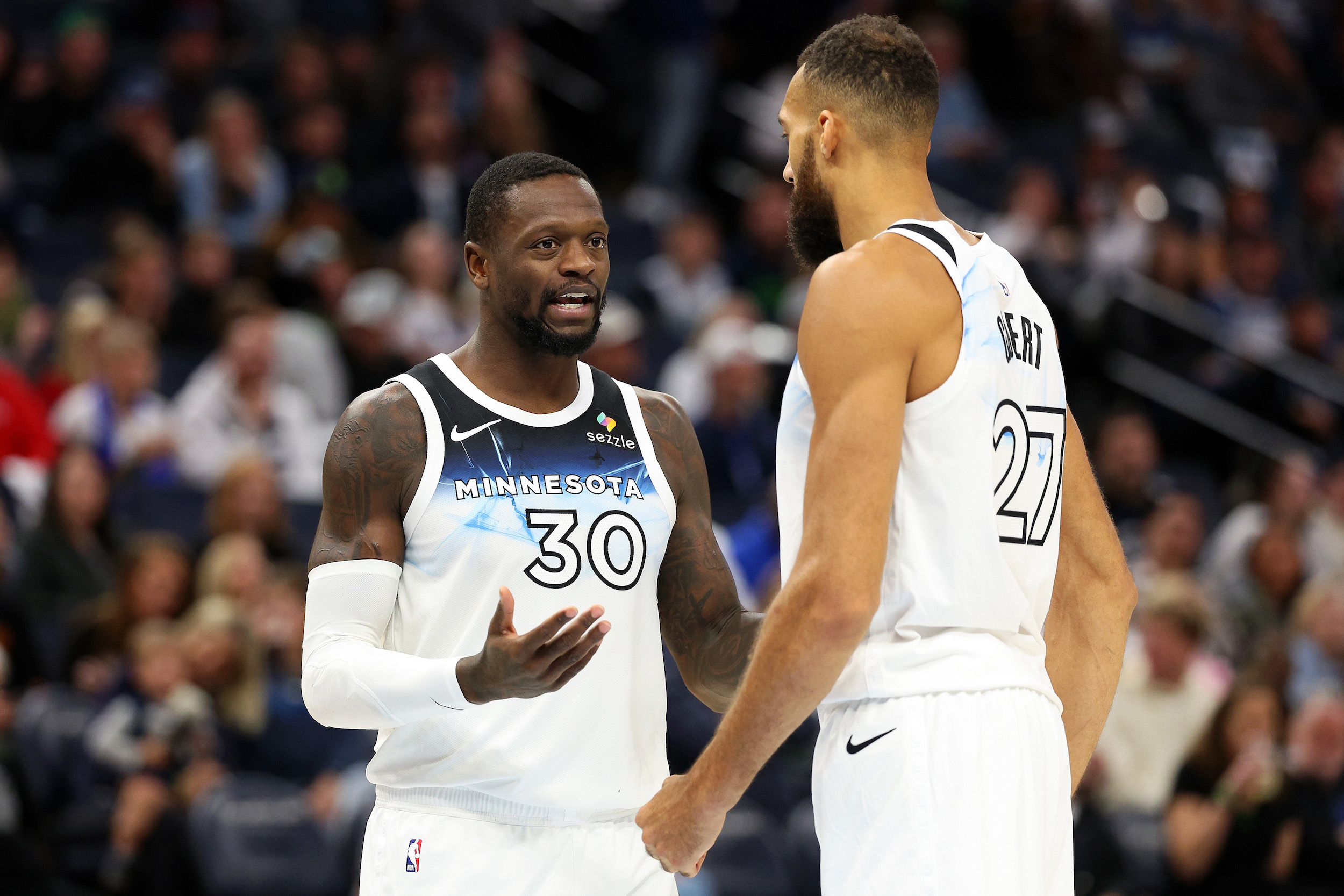 MINNEAPOLIS, MINNESOTA - NOVEMBER 17: Julius Randle #30 of the Minnesota Timberwolves interacts with Rudy Gobert #27 in the third quarter against the Phoenix Suns at Target Center on November 17, 2024 in Minneapolis, Minnesota. The Timberwolves defeated the Suns 120-117. NOTE TO USER: User expressly acknowledges and agrees that, by downloading and or using this photograph, User is consenting to the terms and conditions of the Getty Images License Agreement. (Photo by David Berding/Getty Images)