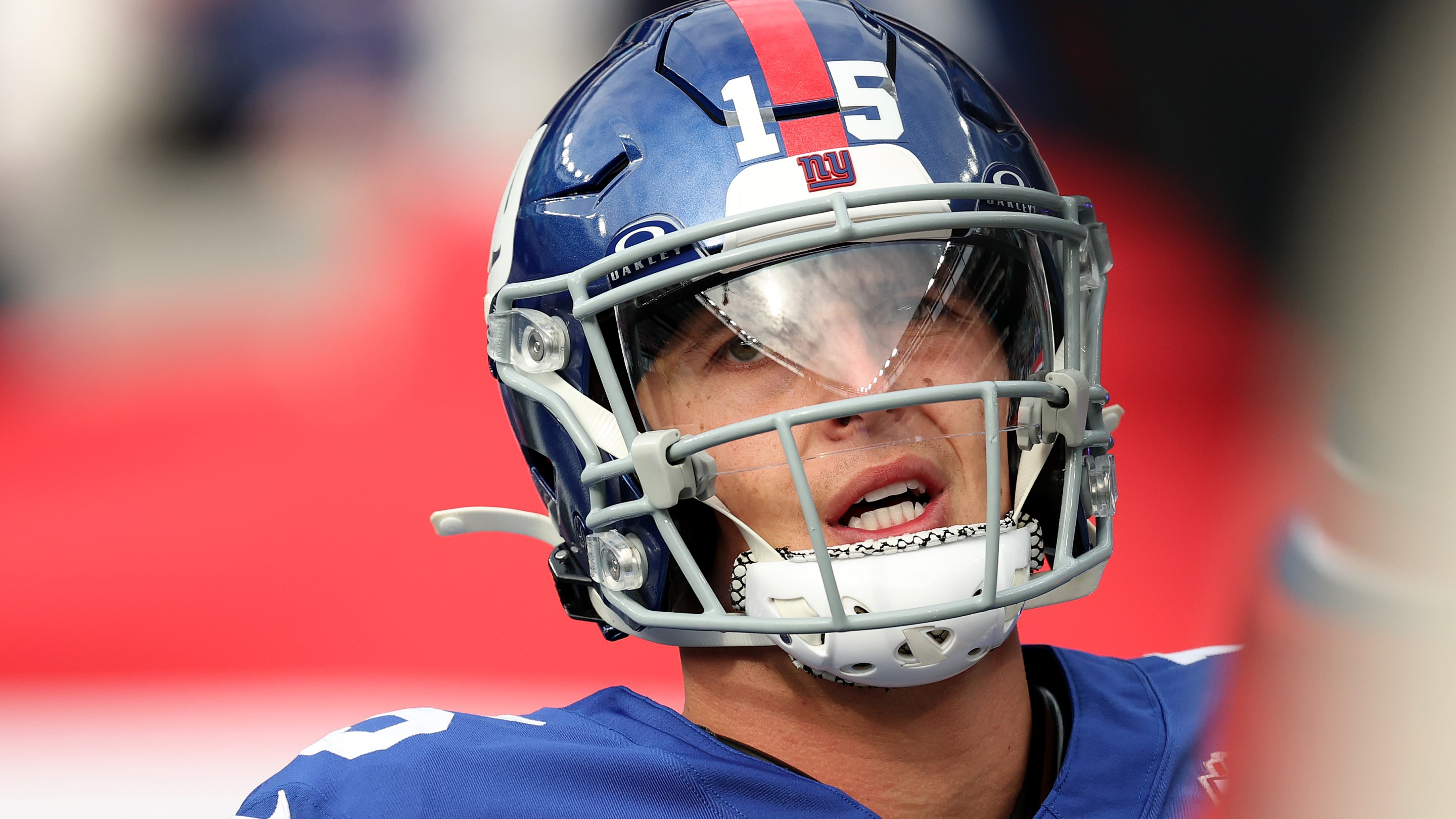 Tommy DeVito of the New York Giants looks pained while warming up before the game against the Tampa Bay Buccaneers at MetLife Stadium on November 24, 2024.