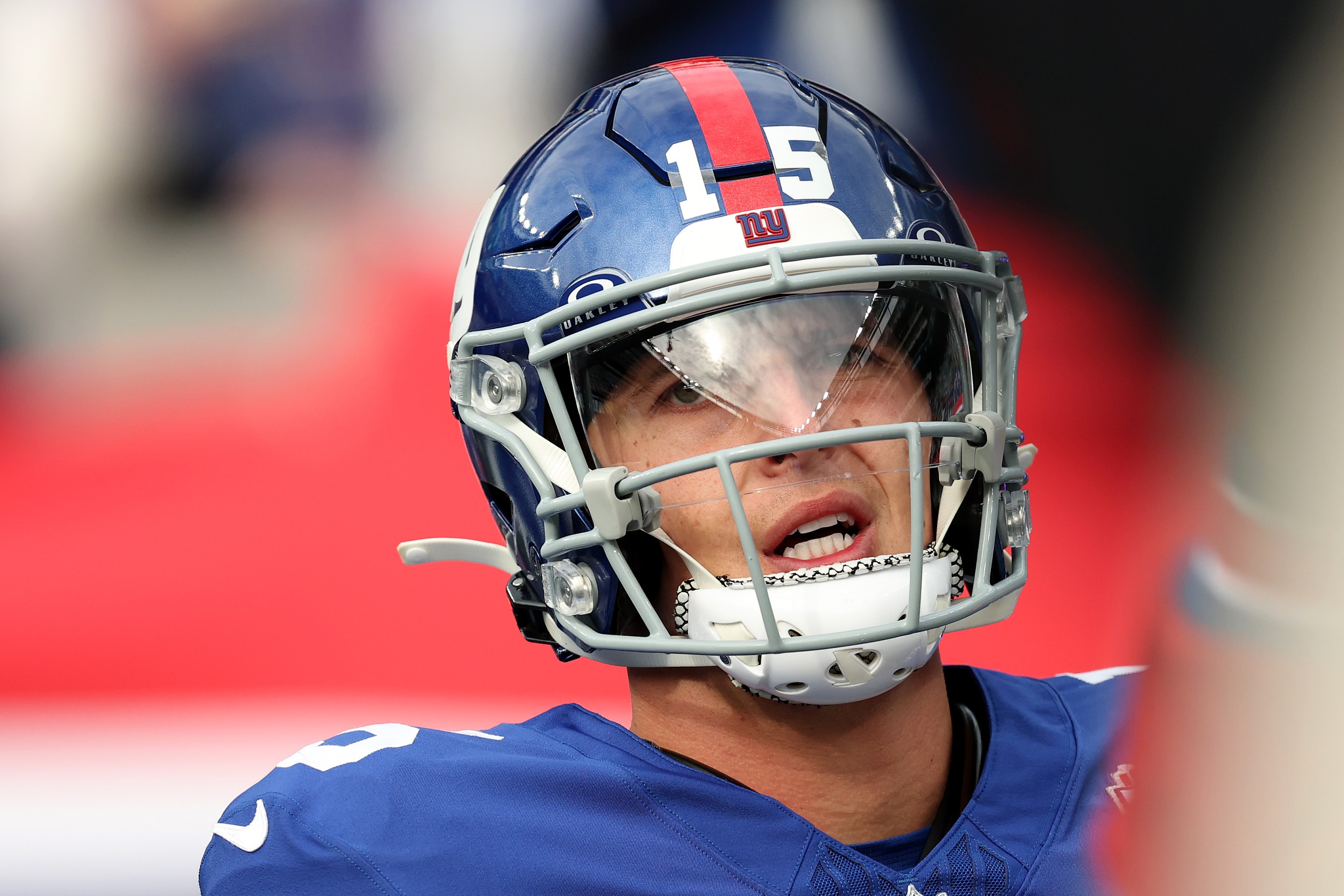 Tommy DeVito of the New York Giants looks pained while warming up before the game against the Tampa Bay Buccaneers at MetLife Stadium on November 24, 2024.