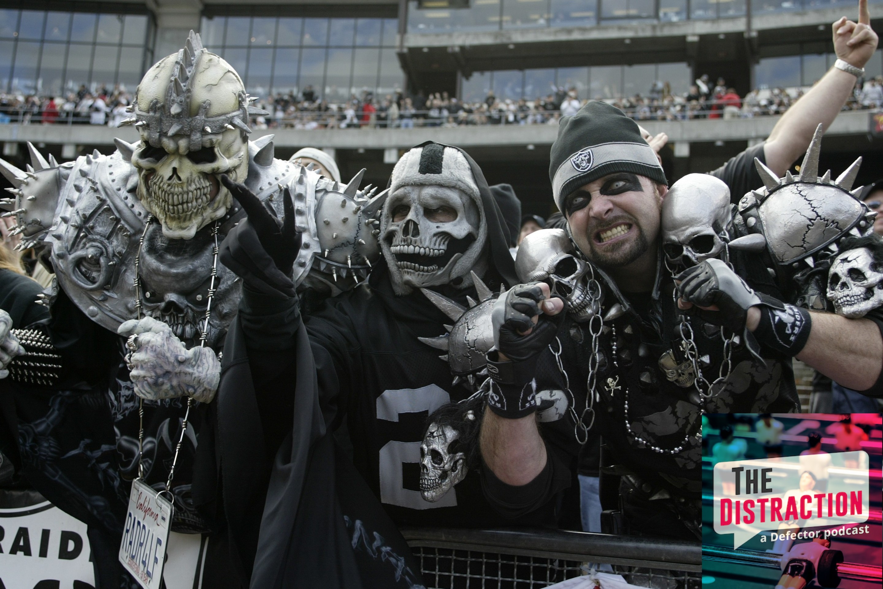 Closeup of painted Oakland Raiders fans in Black Hole during game vs New York Jets in Oakland in 2003. They've got like weird helmets and skull stuff going on.