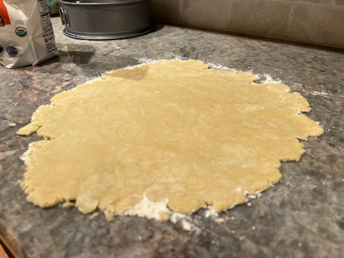 Pie dough rolled flat.