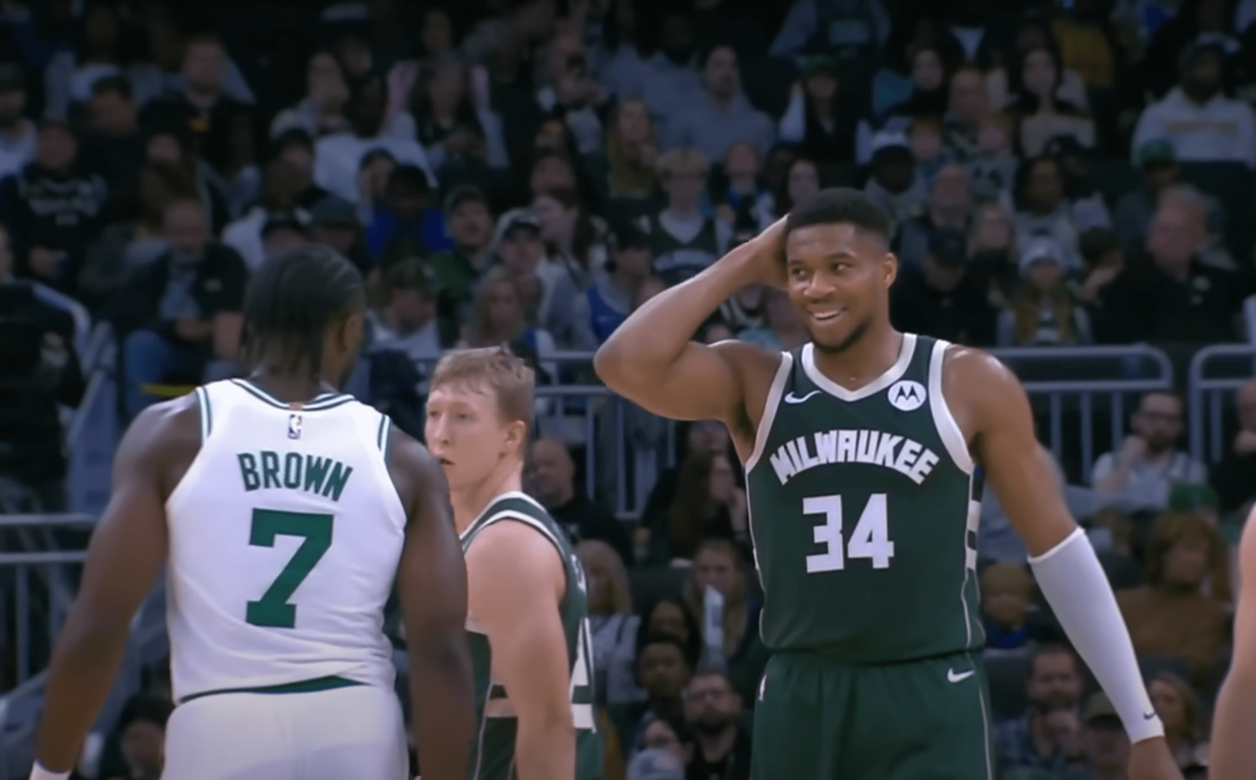 Giannis Antetokounmpo smiles after pranking Jaylen Brown.