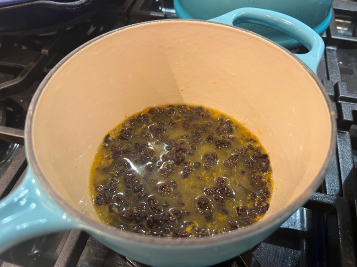 Currants simmering in orange and lemon juice.