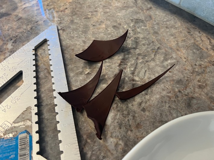 Curved triangles of tempered chocolate.