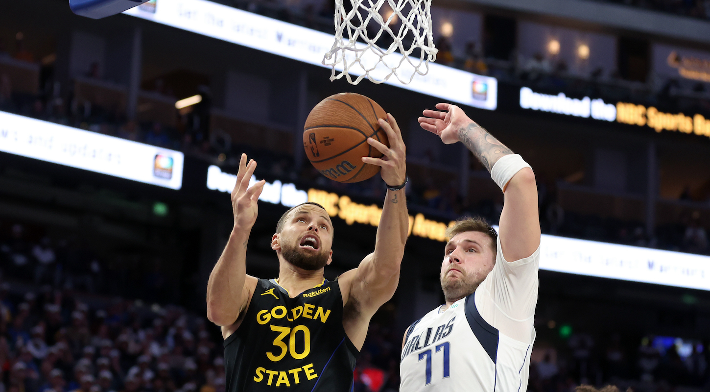 Stephen Curry #30 of the Golden State Warriors goes up for a shot on Luka Doncic #77 of the Dallas Mavericks on November 12, 2024 in San Francisco, California.