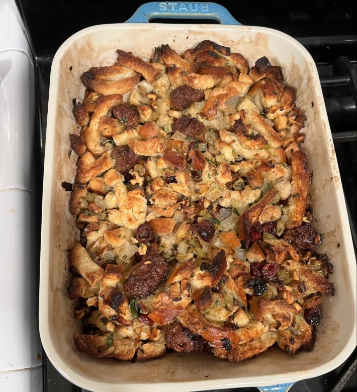 A roasting pan with cooked bread stuffing in it.