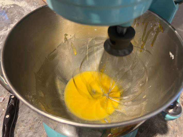 Egg yolks, sugar, and cornstarch are whipped in a stand mixer.