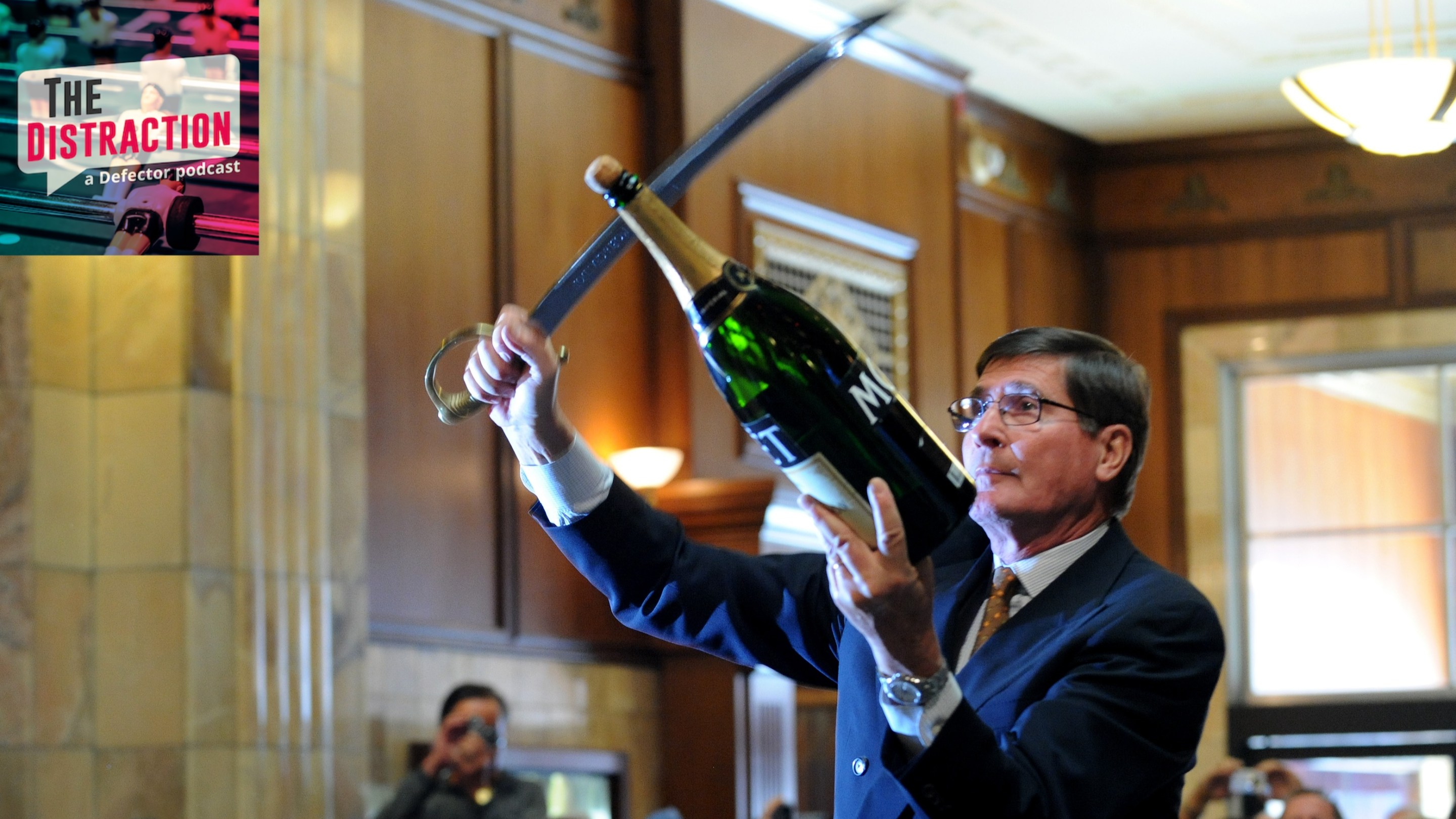 A master swordsman named Bernard Ganter uses a saber to open an enormous bottle of Moet & Chandon at a celebration in Denver, Co.