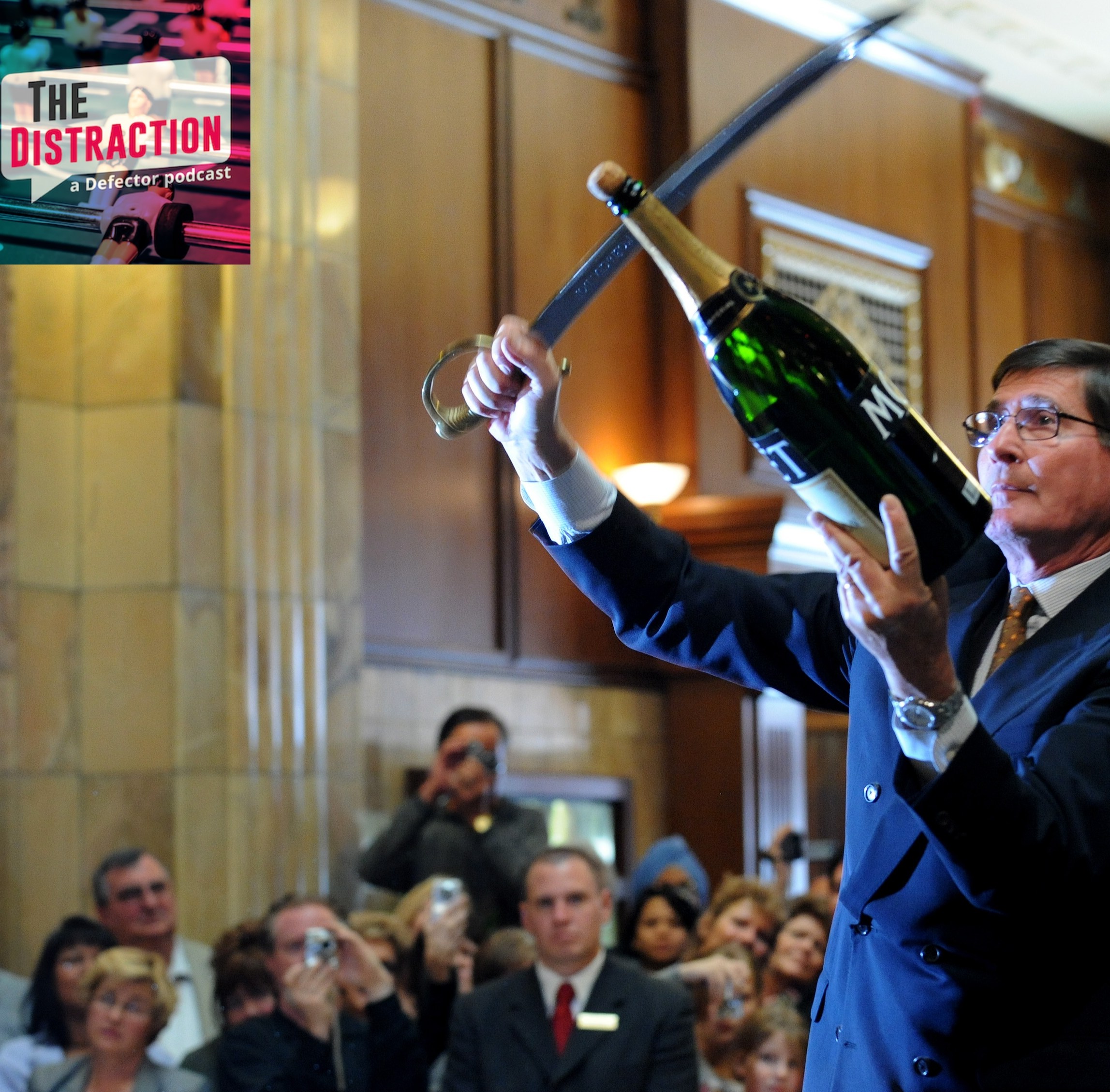 A master swordsman named Bernard Ganter uses a saber to open an enormous bottle of Moet & Chandon at a celebration in Denver, Co.