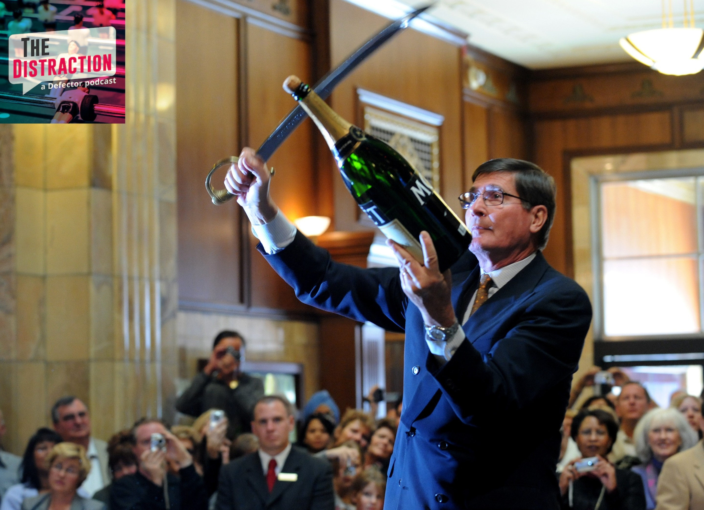 A master swordsman named Bernard Ganter uses a saber to open an enormous bottle of Moet & Chandon at a celebration in Denver, Co.