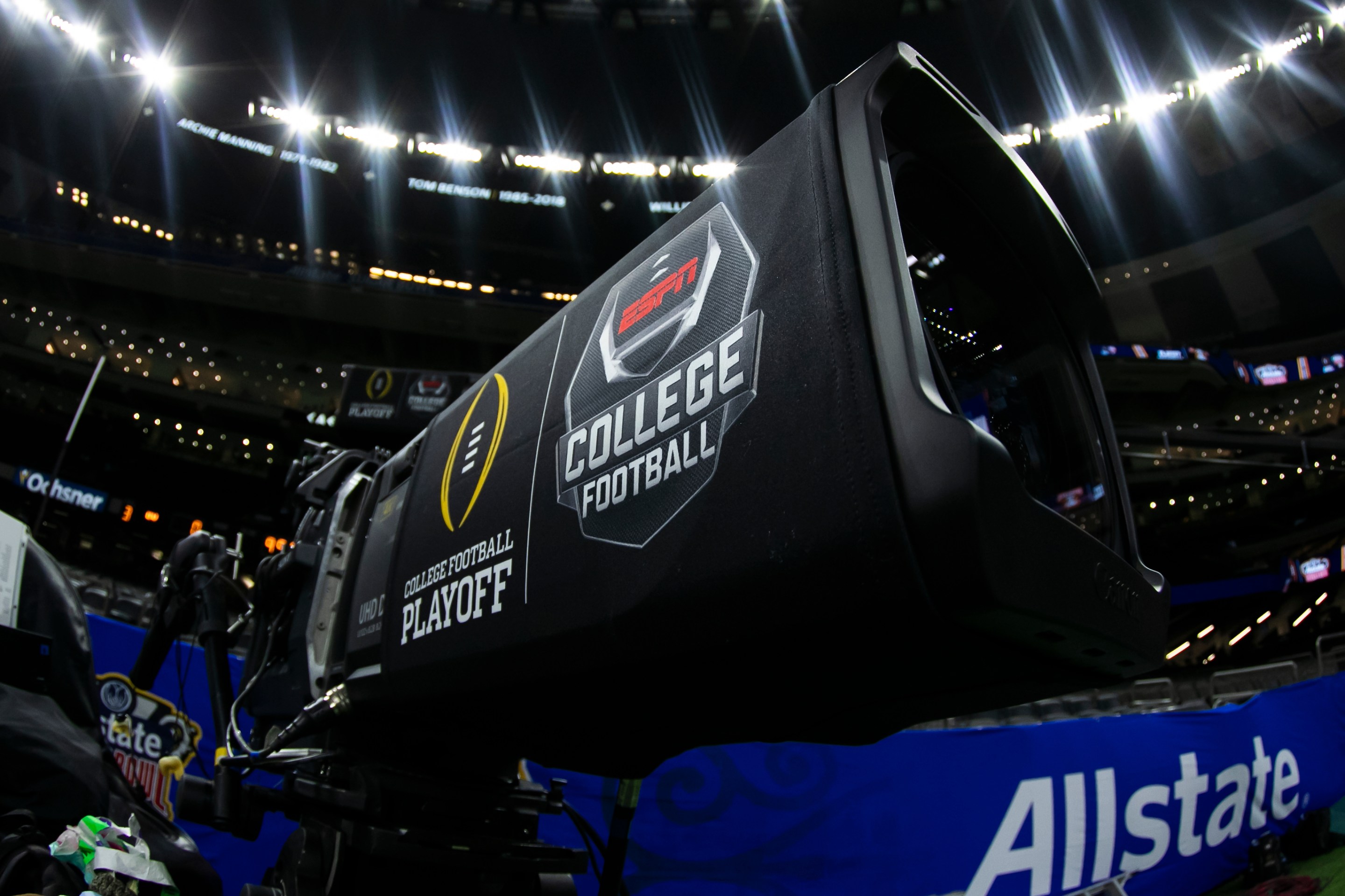 The college football playoff logo on an ESPN camera.