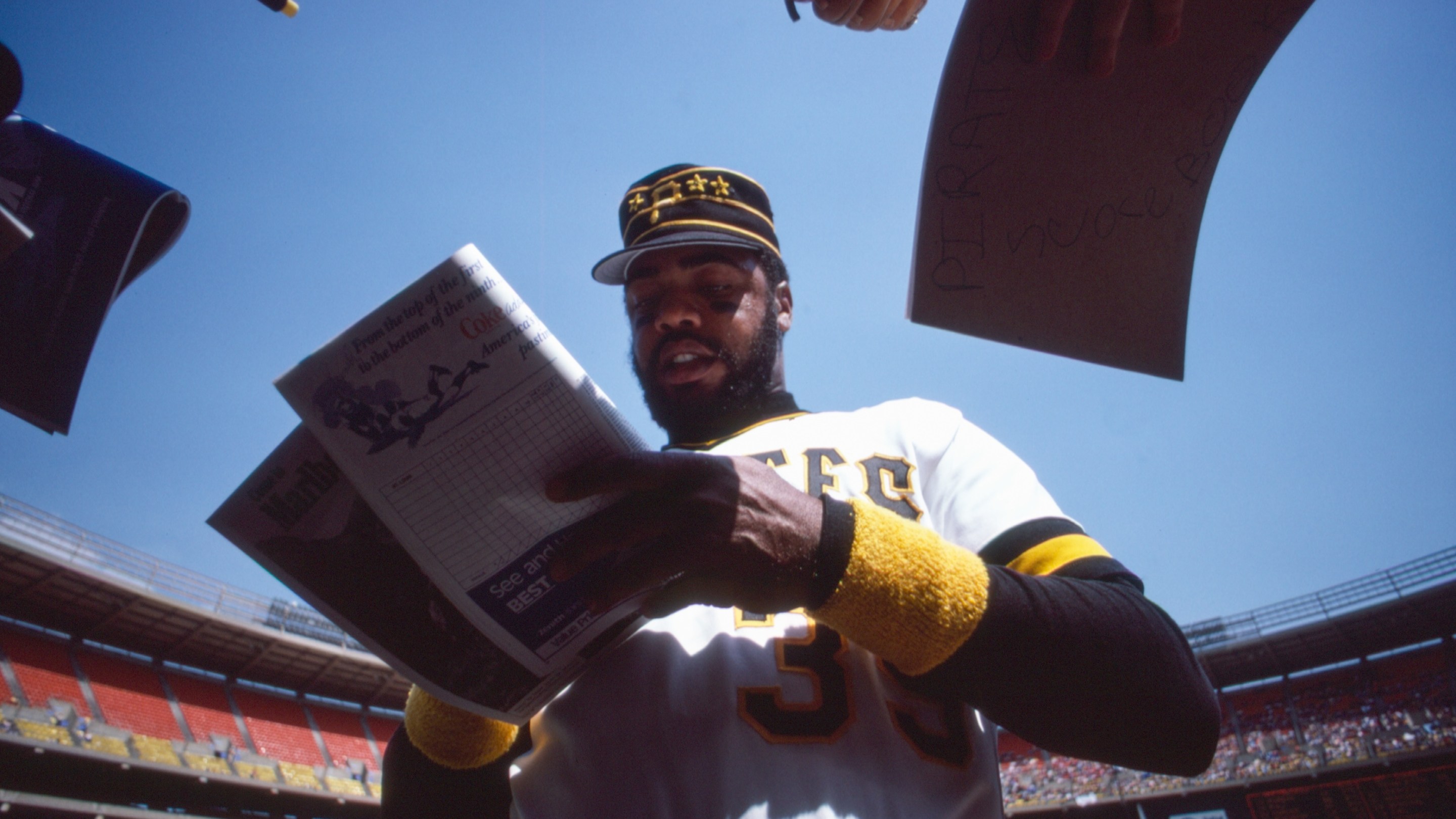 Pittsburgh Pirates right-fielder and All-Star Dave Parker (#39) signs some autographs for fans at a game in April of 1980 at Three Rivers Stadium in Pittsburgh, Pennsylvania.