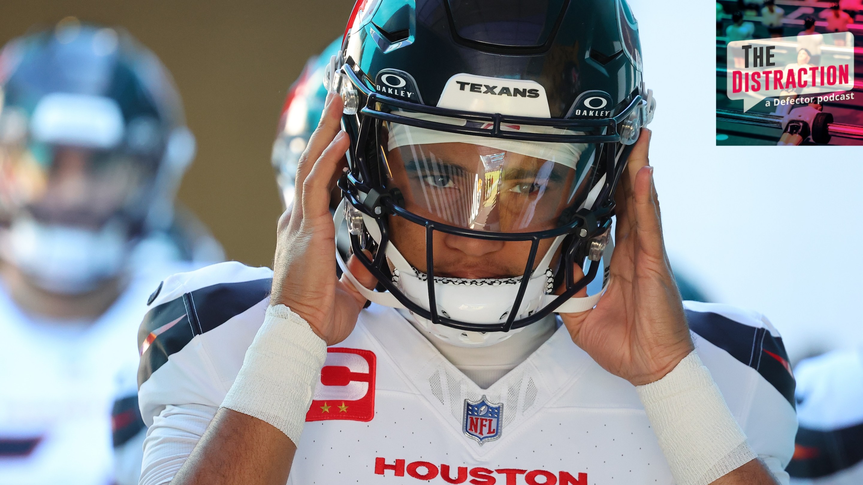 C.J. Stroud of the Houston Texans adjusts his helmet in close-up before taking the field for Houston's game against Jacksonville on December 1, 2024.