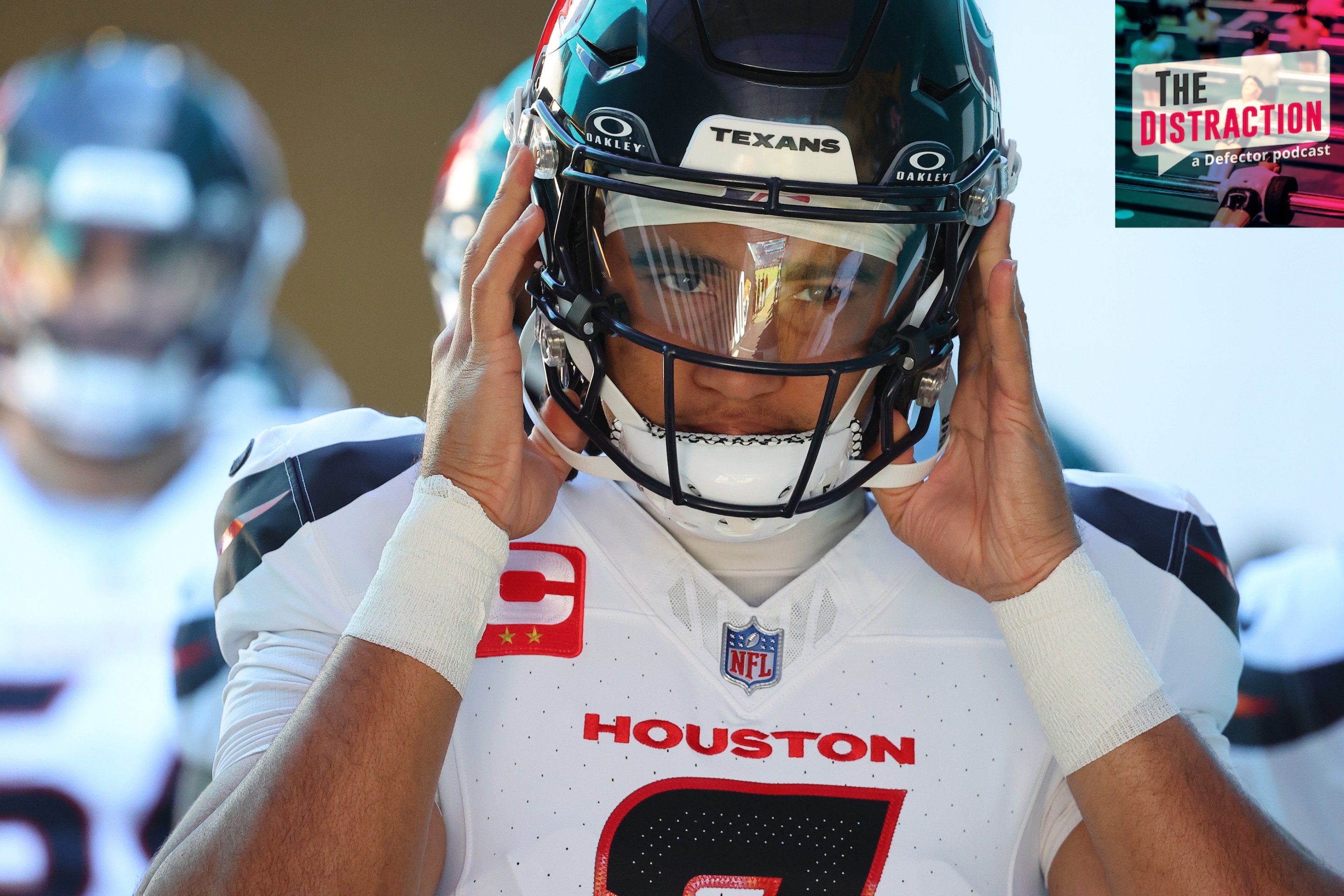 C.J. Stroud of the Houston Texans adjusts his helmet in close-up before taking the field for Houston's game against Jacksonville on December 1, 2024.