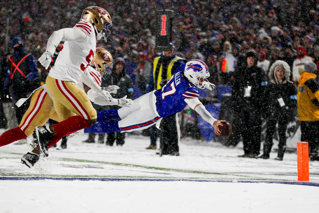 ORCHARD PARK, NEW YORK - DECEMBER 01: Josh Allen #17 of the Buffalo Bills dives for a touchdown in the third quarter of a game against the San Francisco 49ers at Highmark Stadium on December 01, 2024 in Orchard Park, New York.