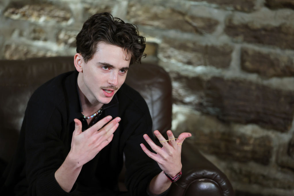 Actor Timothee Chalamet answers questions on a press tour.