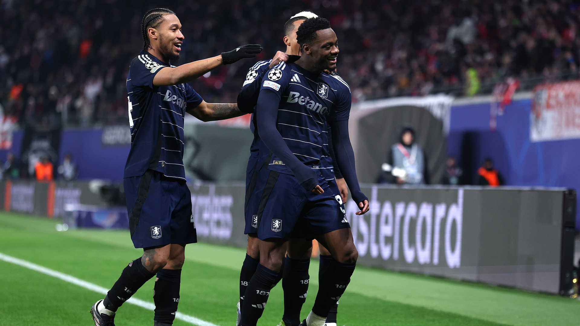 Jhon Duran of Aston Villa celebrates scoring his team's second goal with teammates during the UEFA Champions League 2024/25 League Phase MD6 match between RB Leipzig and Aston Villa FC at Leipzig Stadium on December 10, 2024 in Leipzig, Germany.