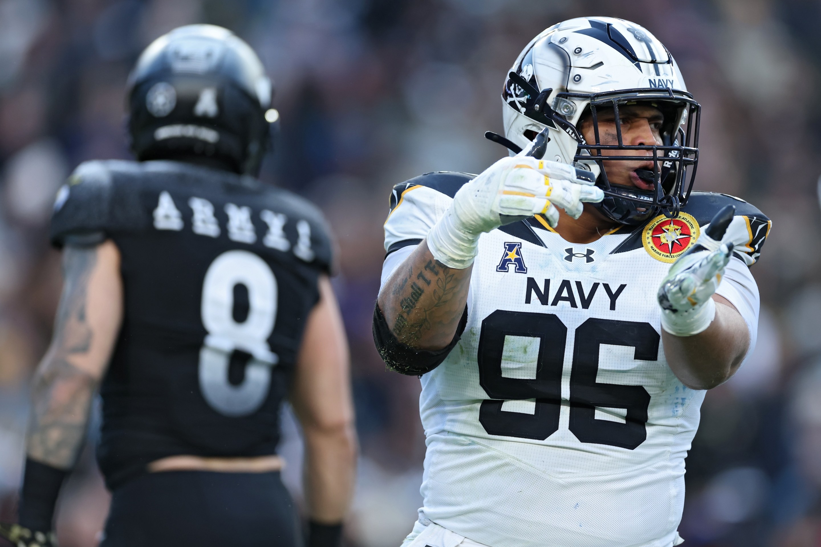 Defensive tackle Landon Robinson #96 of the Navy Midshipmen celebrates a sack against the Army Black Knights during the first half of 125th America's Game between the Army Black Knights and the Navy Midshipmen.