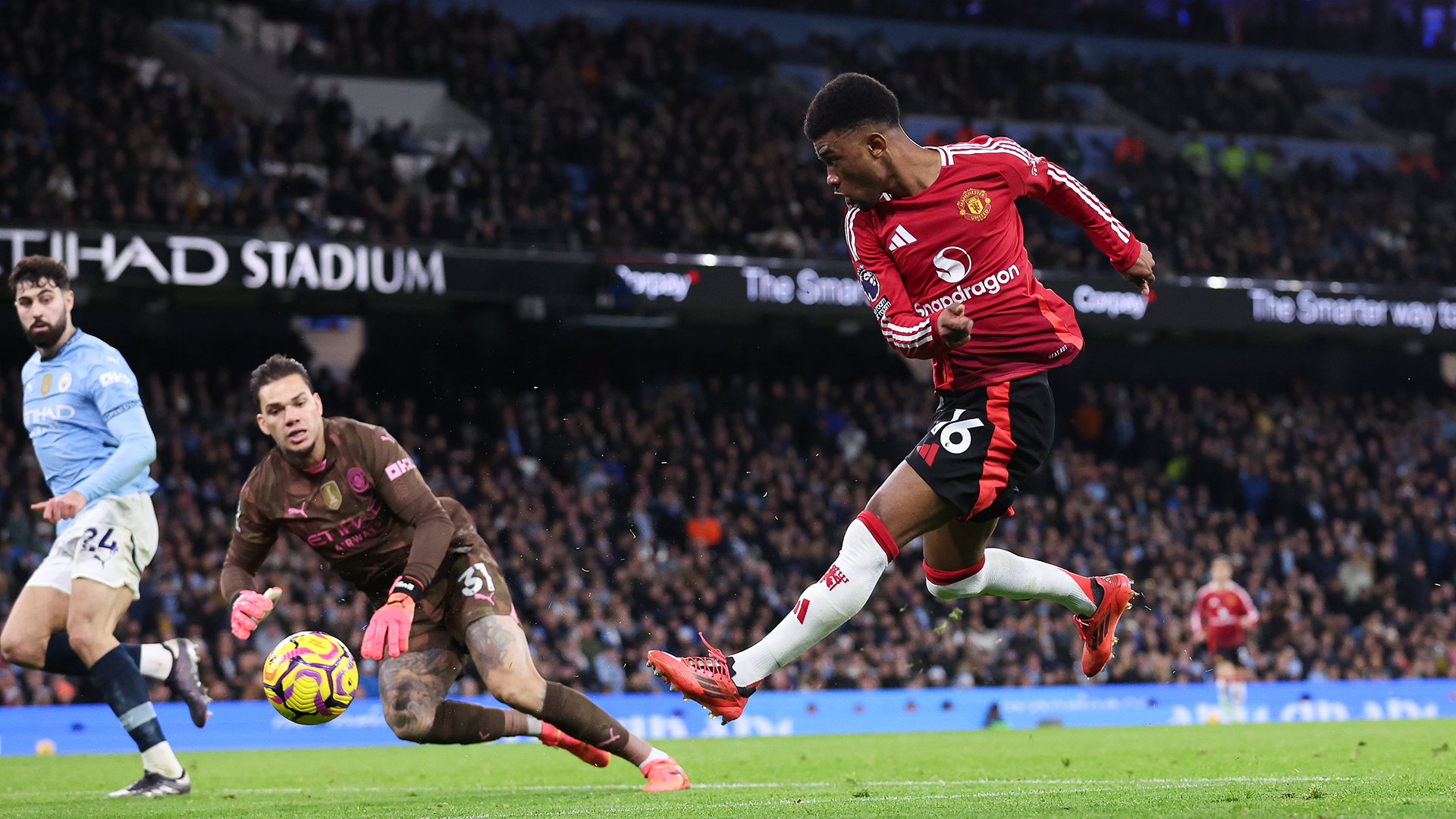 Amad Diallo of Manchester United scores their side's second goal during the Premier League match between Manchester City FC and Manchester United FC at Etihad Stadium on December 15, 2024 in Manchester, England.