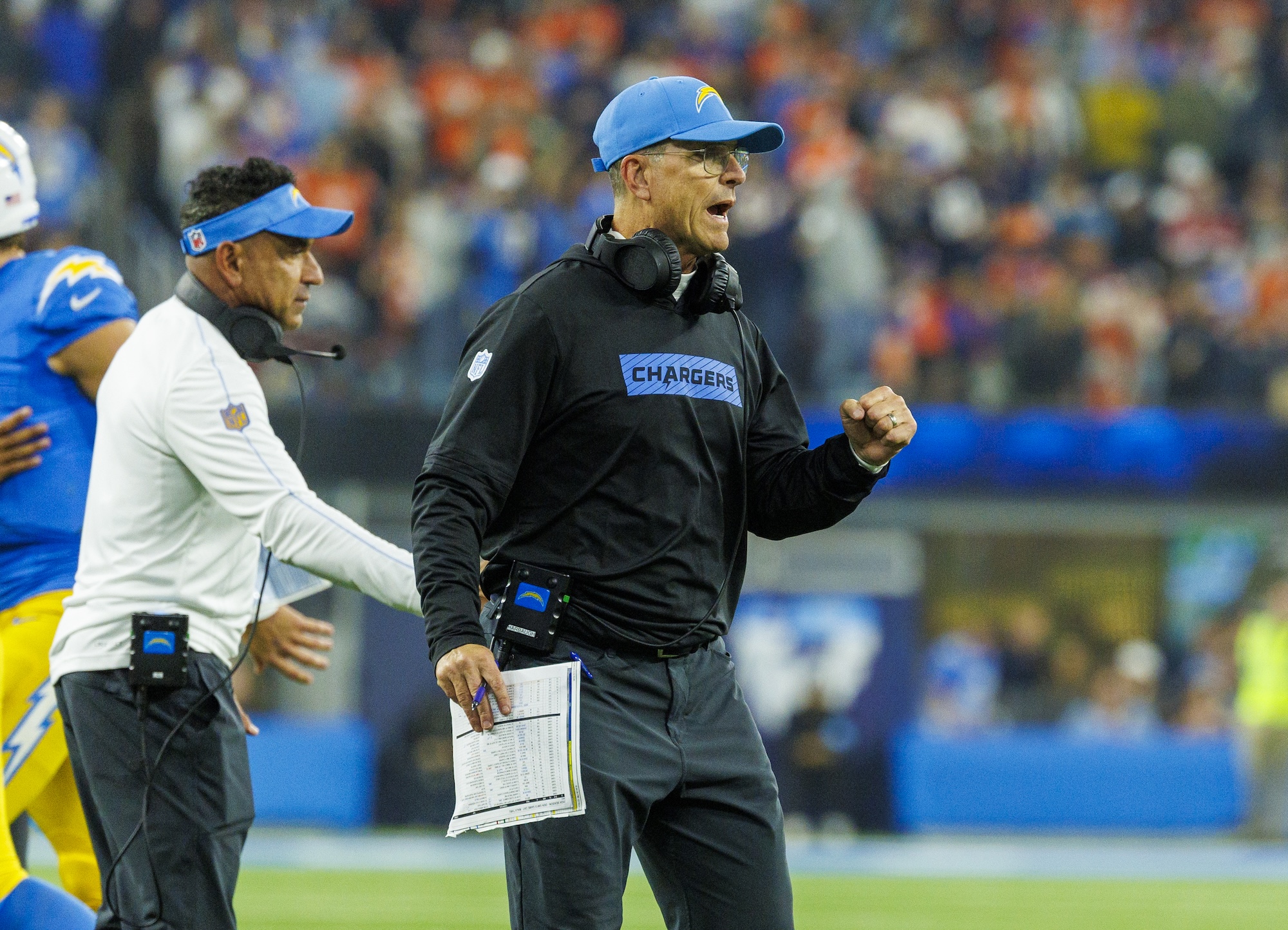 INGLEWOOD, CA - DECEMBER 19, 2024: Los Angeles Chargers head coach Jim Harbaugh reacts after Los Angeles Chargers running back Hassan Haskins (28) scored on a 34 yard touchdown to ice the win over the Denver Broncos at So-Fi Stadium on December 19, 2024 in Inglewood, California. (Gina Ferazzi / Los Angeles Times via Getty Images)