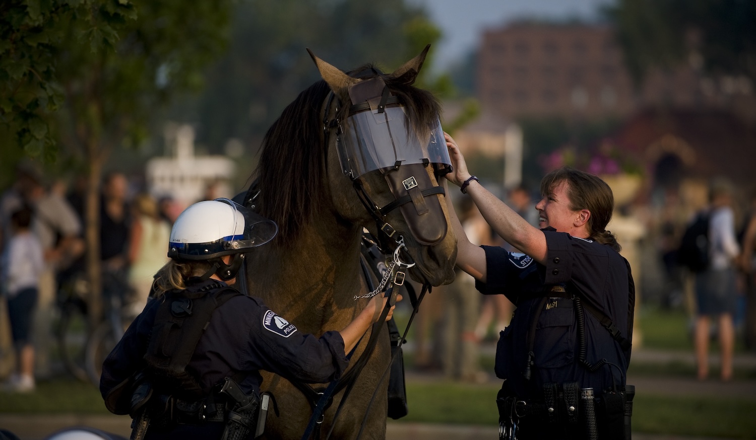 Mounted police officers remove the riot gear from their police horse outside the Xcel Energy Center in St. Paul, MN, site of the 2008 Republican National Convention.