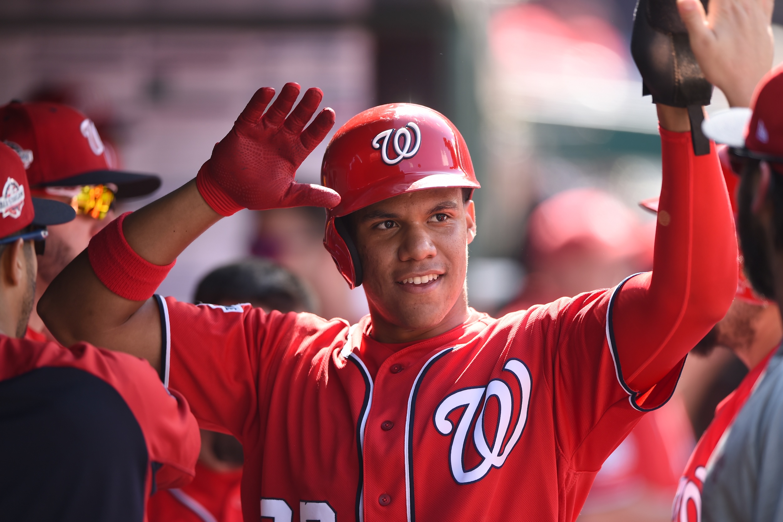 A much younger Juan Soto celebrates a dinger in the Nationals dugout.