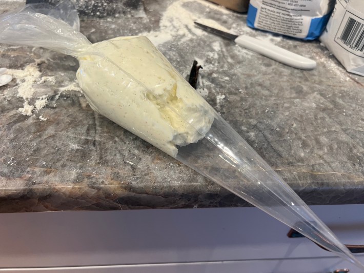 Cream cheese icing in a piping bag.