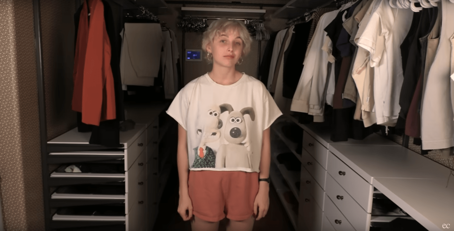 Emma Chamberlain stands in her closet, which has recently been emptied of most of its items.