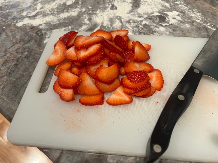 A pile of sliced strawberries.