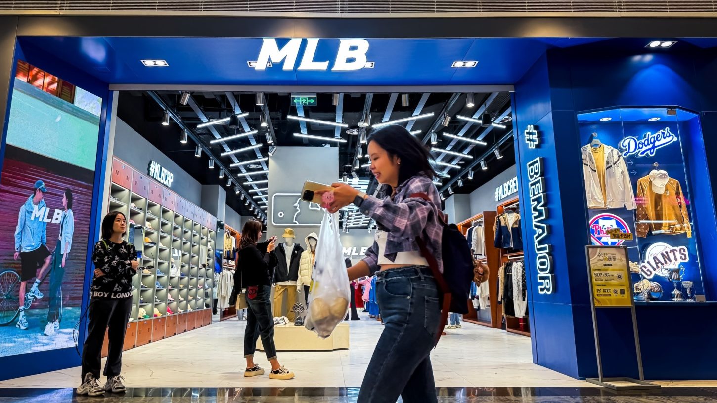 Shoppers walk past an MLB store during the National Day Golden Week holiday at Raffles City Chongqing on October 5, 2024, in Chongqing, China.