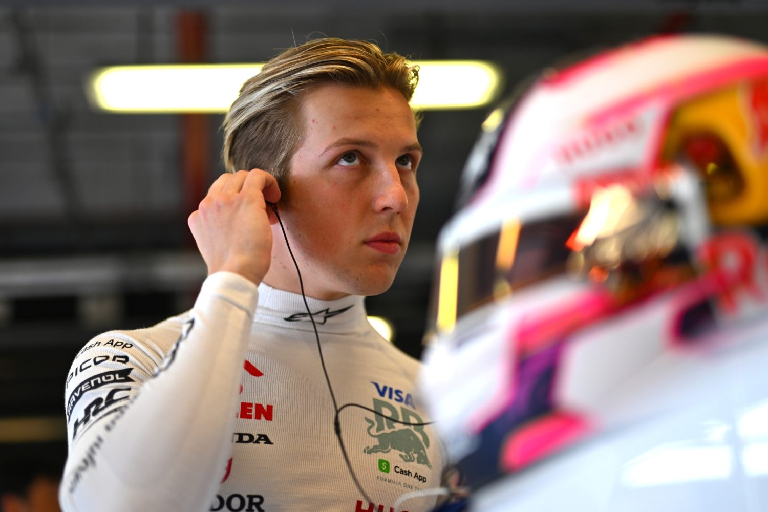 Liam Lawson of New Zealand and Visa Cash App RB prepares to drive in the garage during practice.