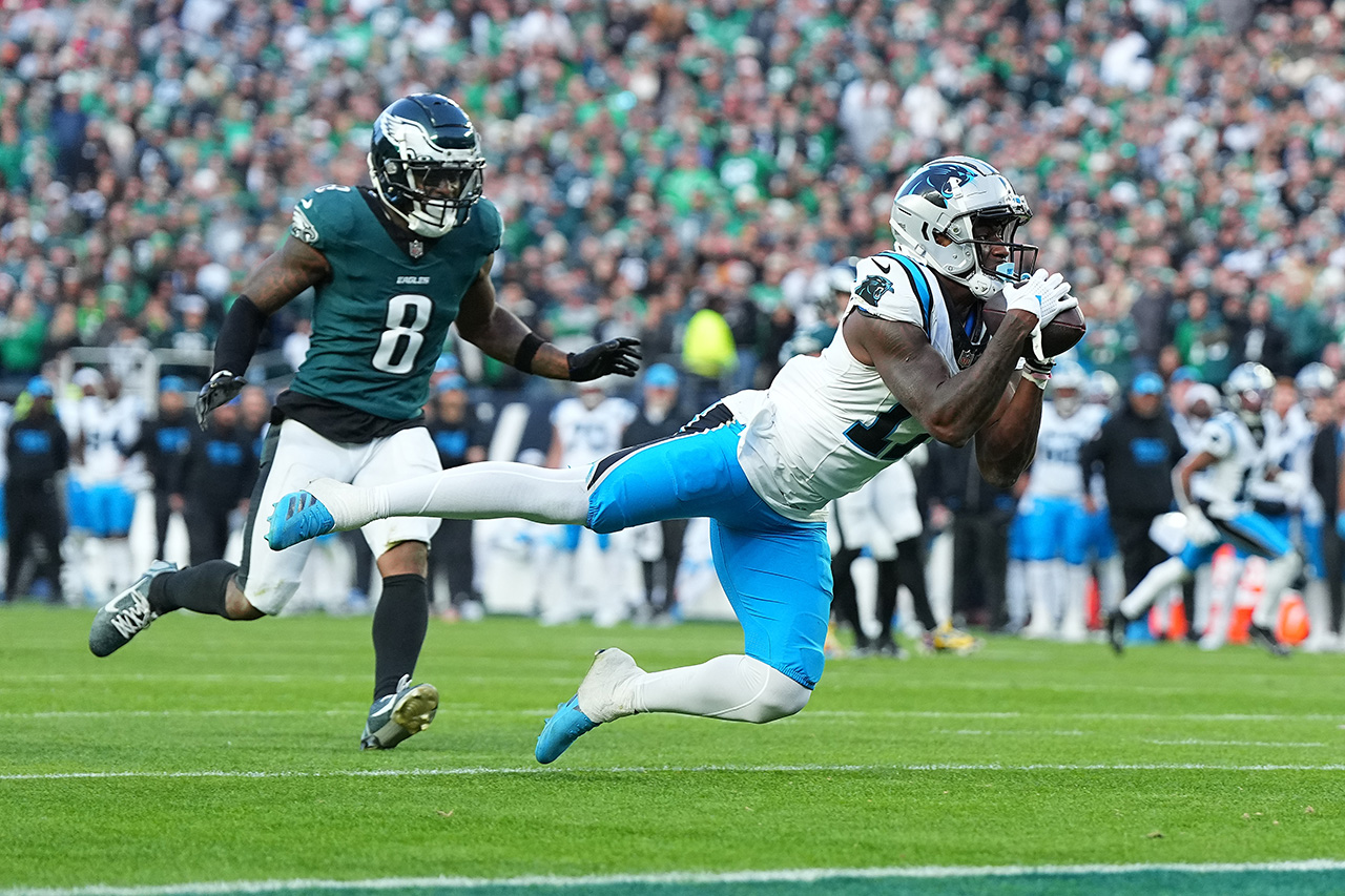 PHILADELPHIA, PENNSYLVANIA - DECEMBER 08: Xavier Legette #17 of the Carolina Panthers drops a pass while being guarded by C.J. Gardner-Johnson #8 of the Philadelphia Eagles in the fourth quarter of a game at Lincoln Financial Field on December 08, 2024 in Philadelphia, Pennsylvania.