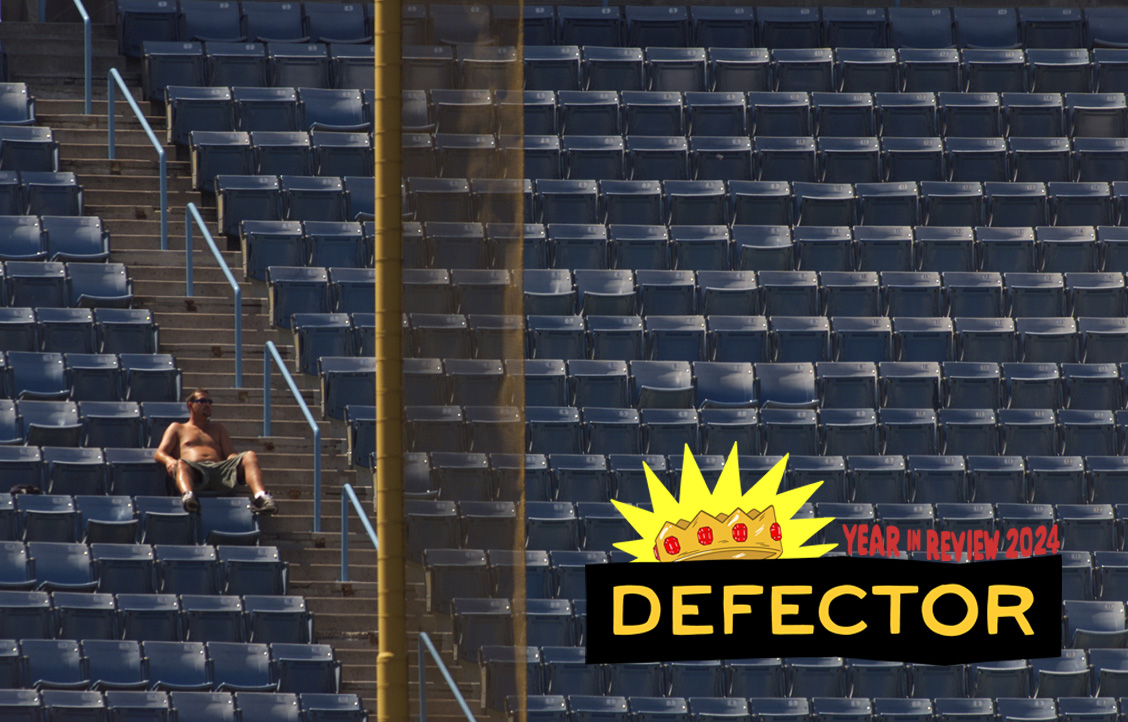 A fan lands himself just foul in the upper level leftfield seats as he keeps cool and takes in the Dodger/Seattle interleague game, Sunday afternoon at Dodger Stadium.