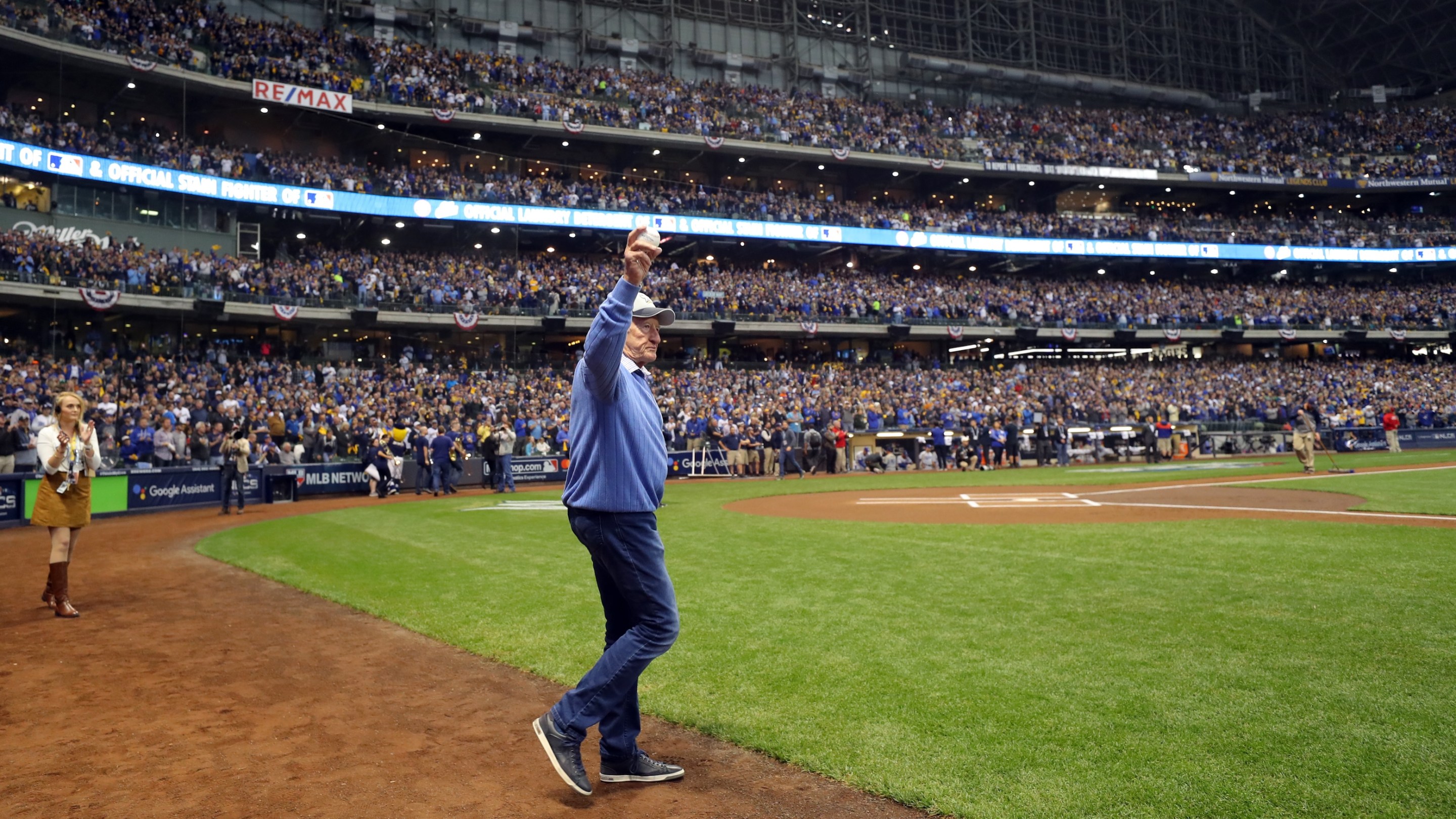 Bob Uecker walks onto the field to throw out the ceremonial first pitch before Game 1 of the NLCS between the Los Angeles Dodgers and the Milwaukee Brewers at Miller Park.