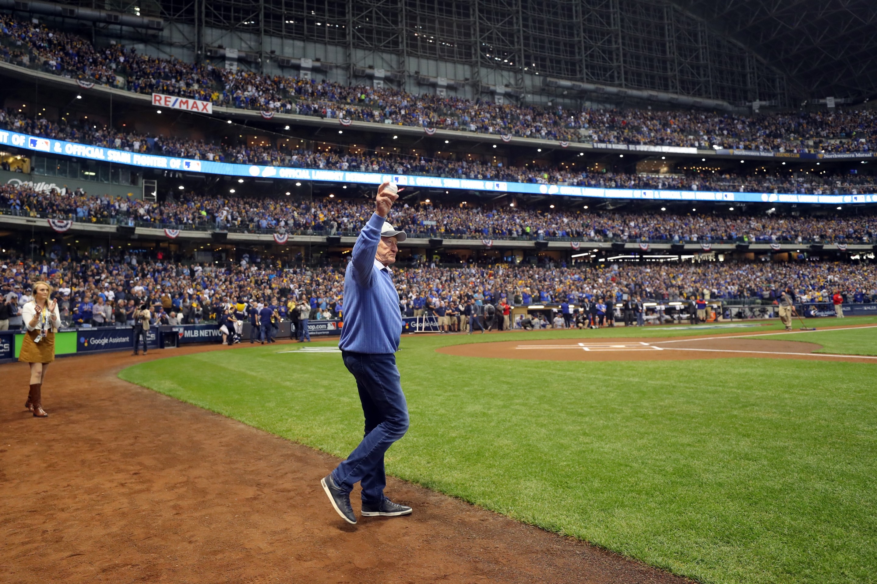 Bob Uecker walks onto the field to throw out the ceremonial first pitch before Game 1 of the NLCS between the Los Angeles Dodgers and the Milwaukee Brewers at Miller Park.