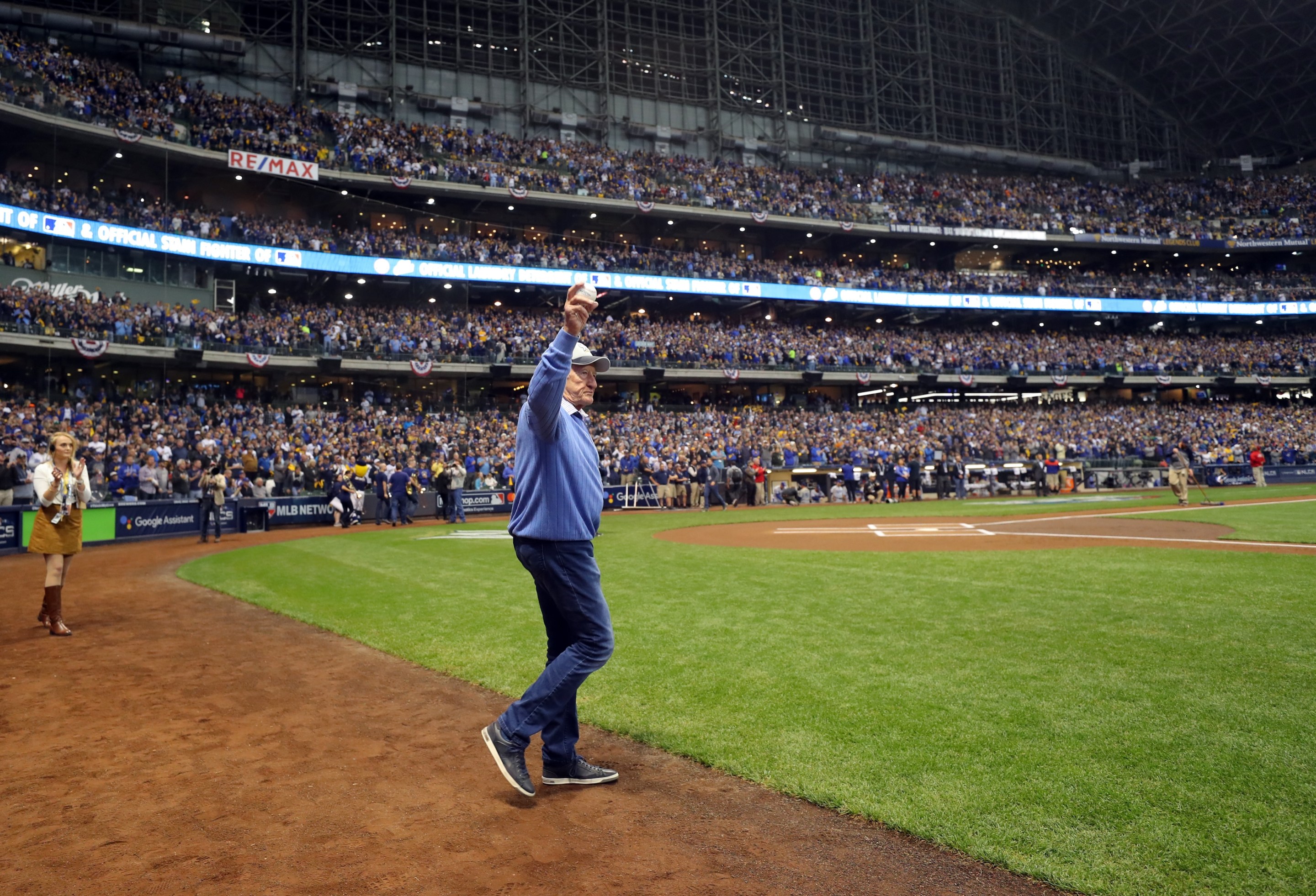 Bob Uecker walks onto the field to throw out the ceremonial first pitch before Game 1 of the NLCS between the Los Angeles Dodgers and the Milwaukee Brewers at Miller Park.