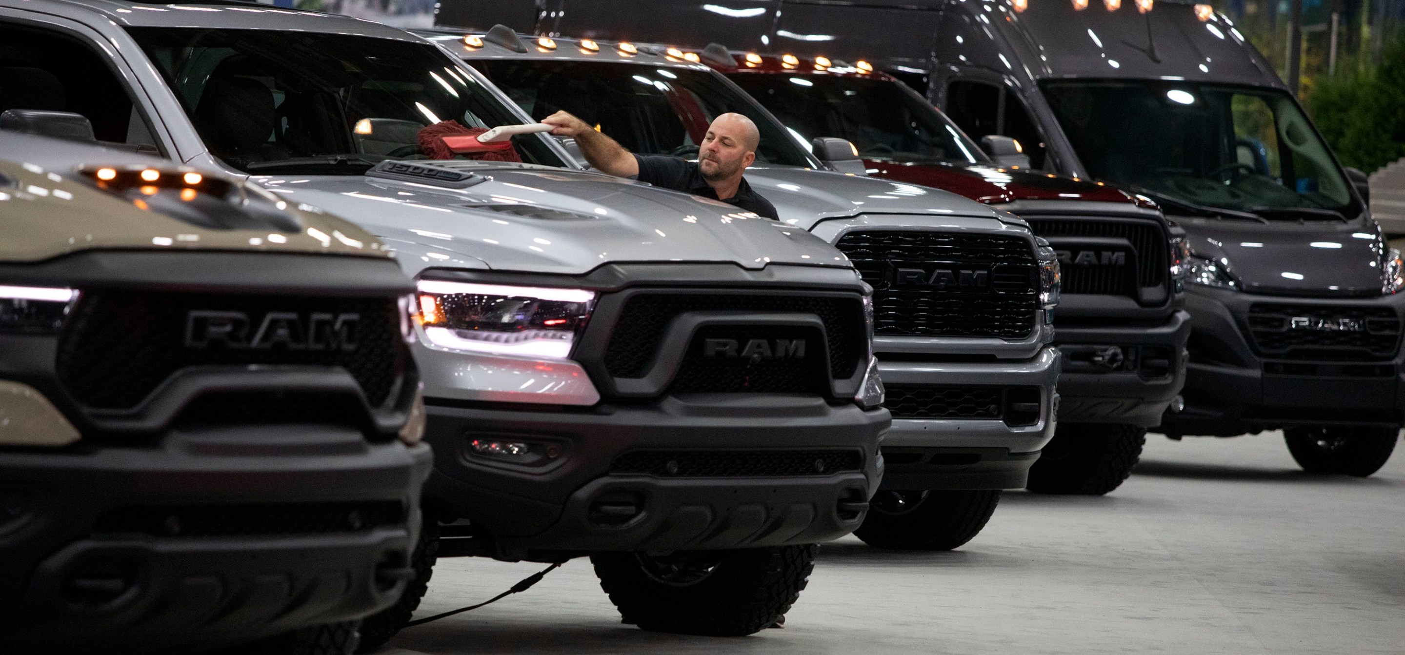 DETROIT, MI - SEPTEMBER 14: A worker cleans a RAM truck at the 2022 North American International Auto Show on September 14, 2022 in Detroit, Michigan.The NAIAS opens to the public on September 17 and features the latest state of the art electric vehicles, vehicle rides, the world’s first battery-powered Monster Truck, an Air Mobility Experience featuring flight demonstrations of jet suits, hoverboards, and vertical take-off and landing aircraft, a Dinosaur Encounter featuring 80 life-like and life-size dinosaurs, and the world’s largest rubber duck. (Photo by Bill Pugliano/Getty Images)