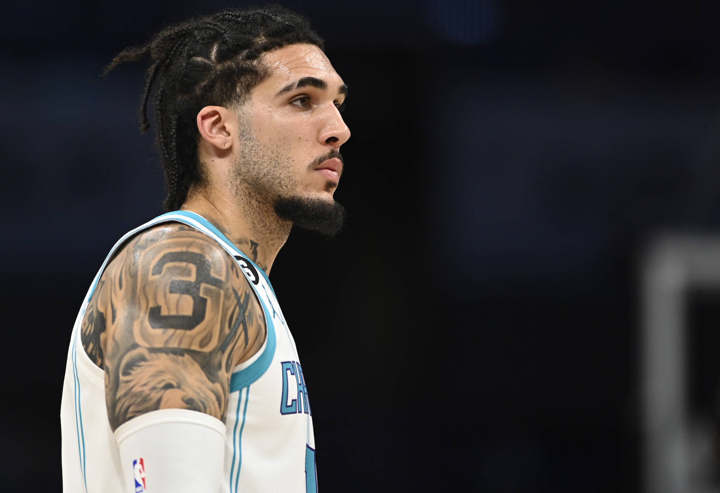 LiAngelo Ball #18 of the Charlotte Hornets stands on the court in the fourth quarter during a preseason game at Spectrum Center on October 05, 2022 in Charlotte, North Carolina. NOTE TO USER: User expressly acknowledges and agrees that, by downloading and or using this photograph, User is consenting to the terms and conditions of the Getty Images License Agreement. (Photo by Eakin Howard/Getty Images)