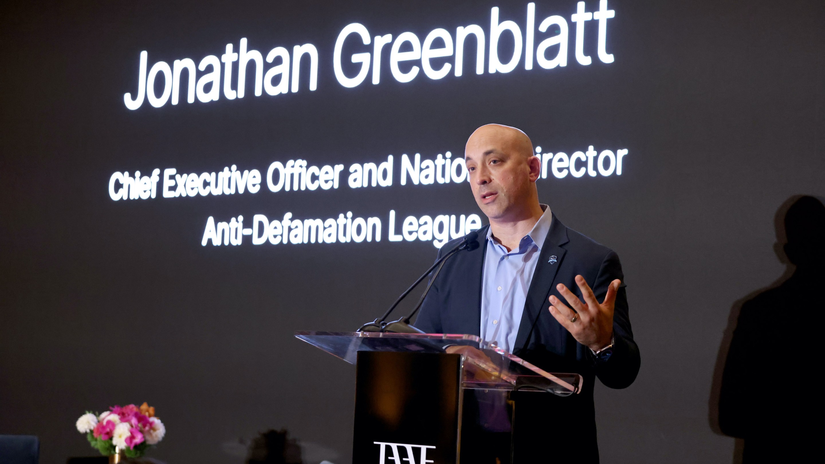 Jonathan Greenblatt of the ADL speaking at a dinner.