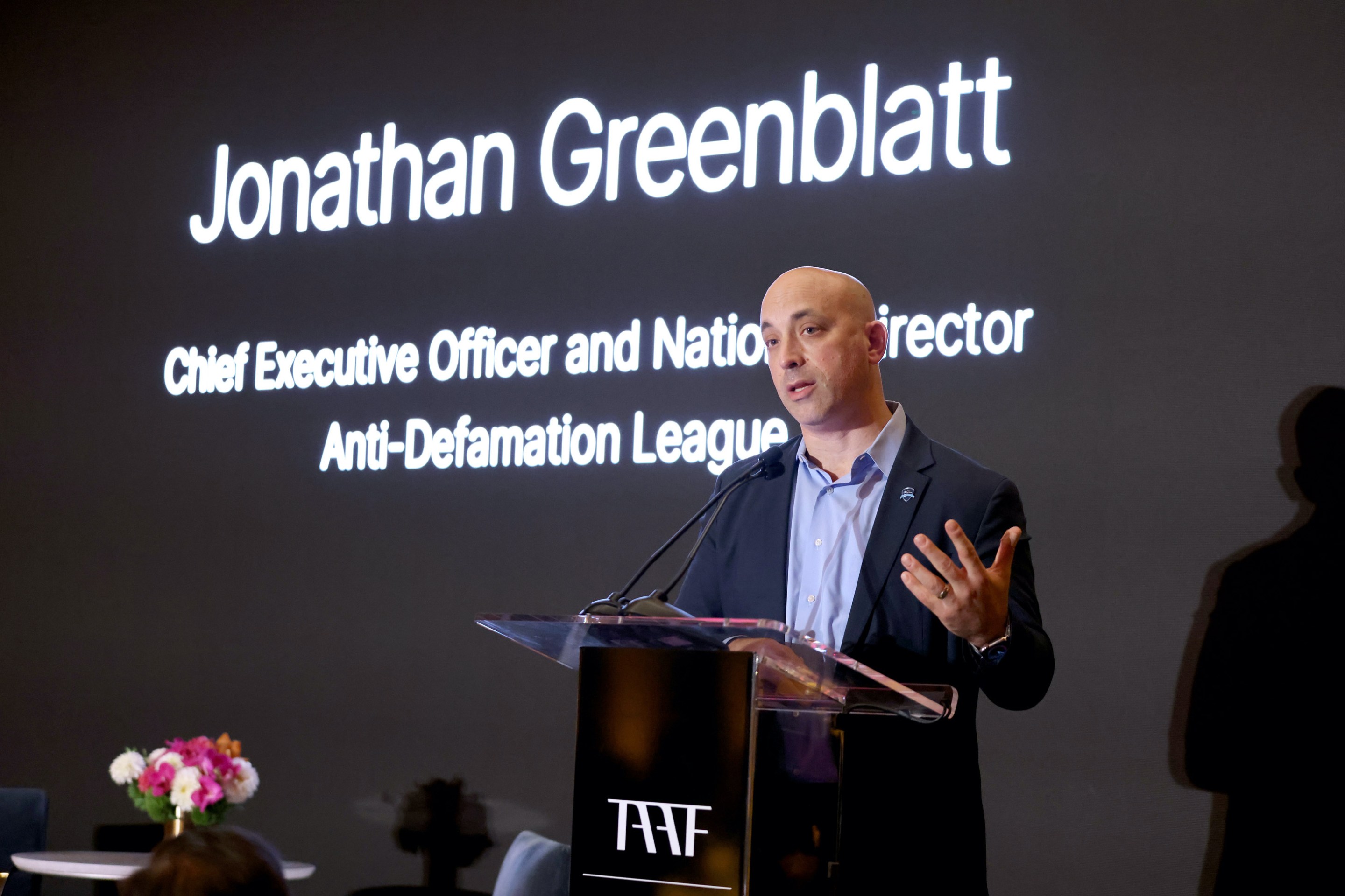 Jonathan Greenblatt of the ADL speaking at a dinner.