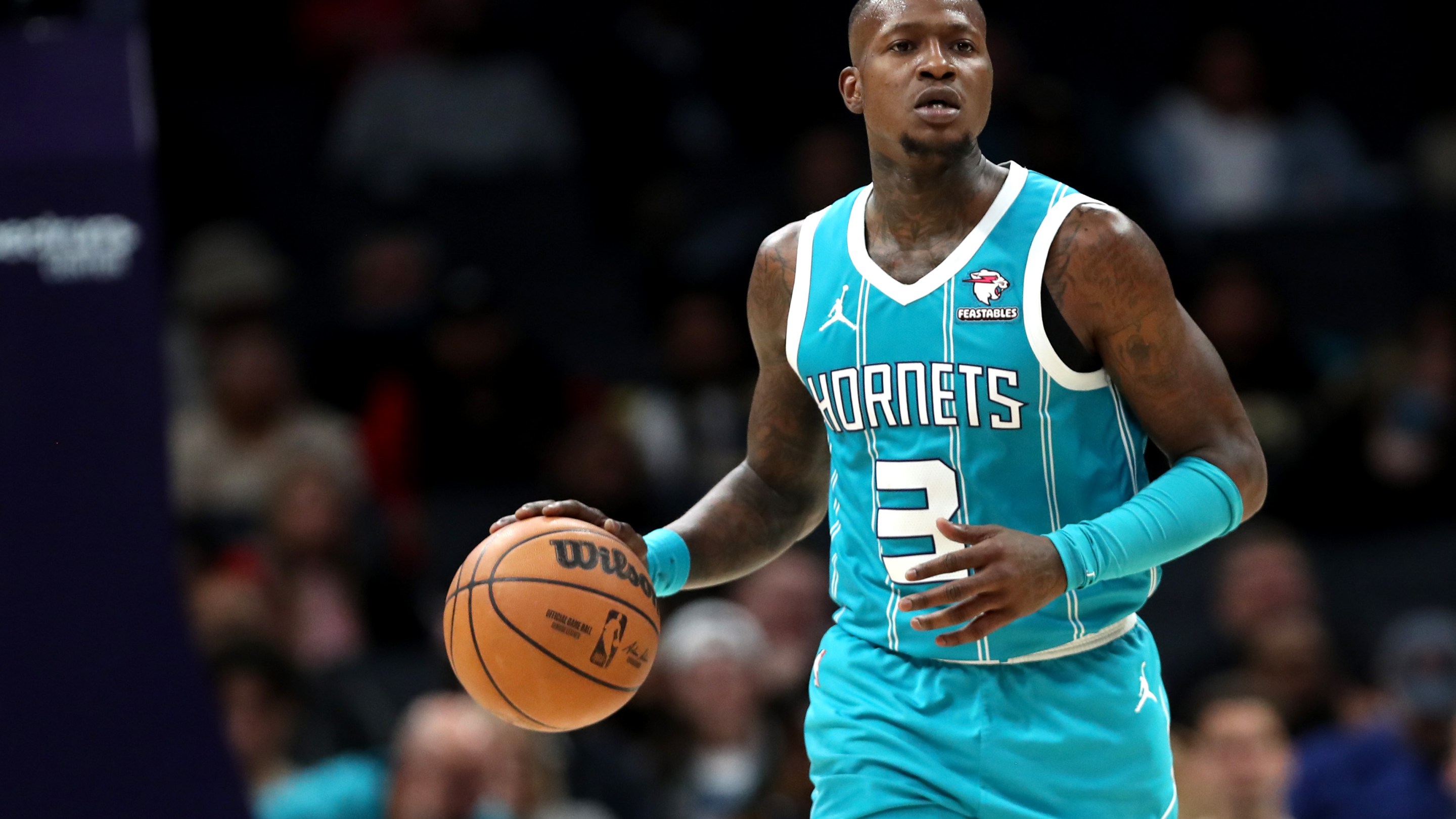 Terry Rozier dribbles a ball as a Charlotte Hornet.