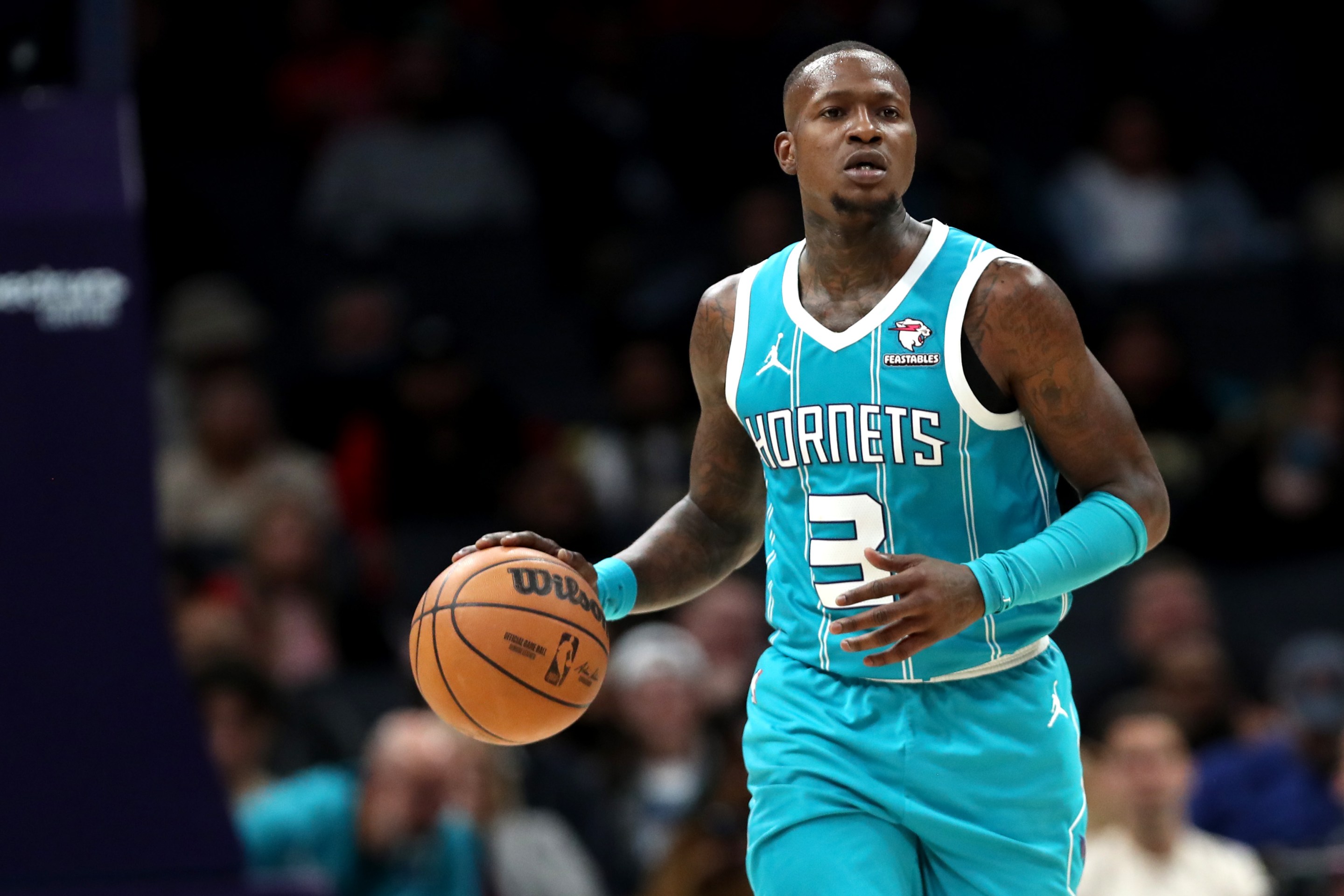 Terry Rozier dribbles a ball as a Charlotte Hornet.