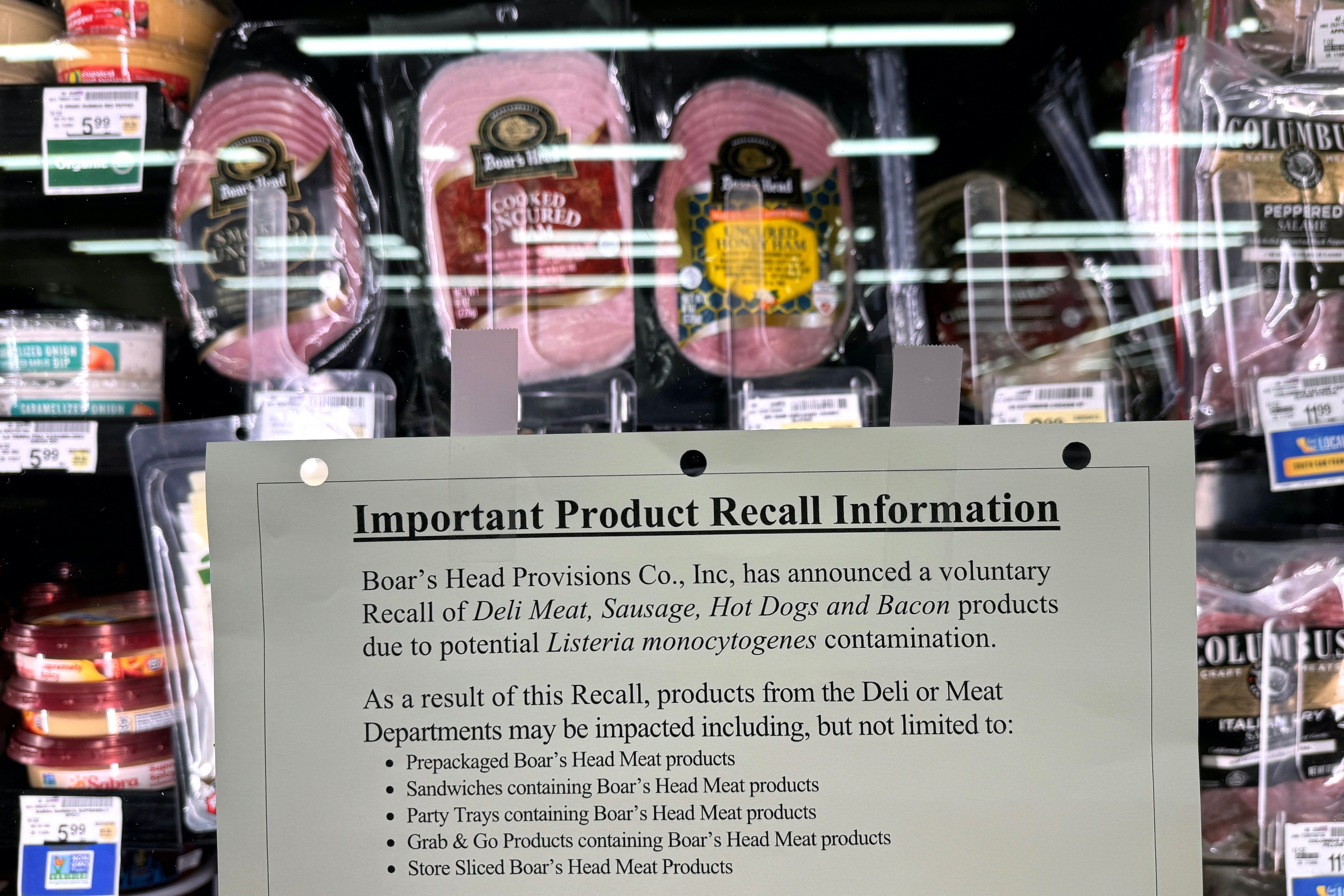 A recall notice on a case of Boar's Head products.