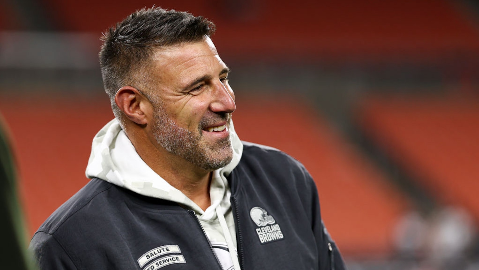 CLEVELAND, OHIO - NOVEMBER 21: Consultant Mike Vrabel of the Cleveland Browns smiles on the field prior to an NFL football game against the Pittsburgh Steelers at Huntington Bank Field on November 21, 2024 in Cleveland, Ohio.