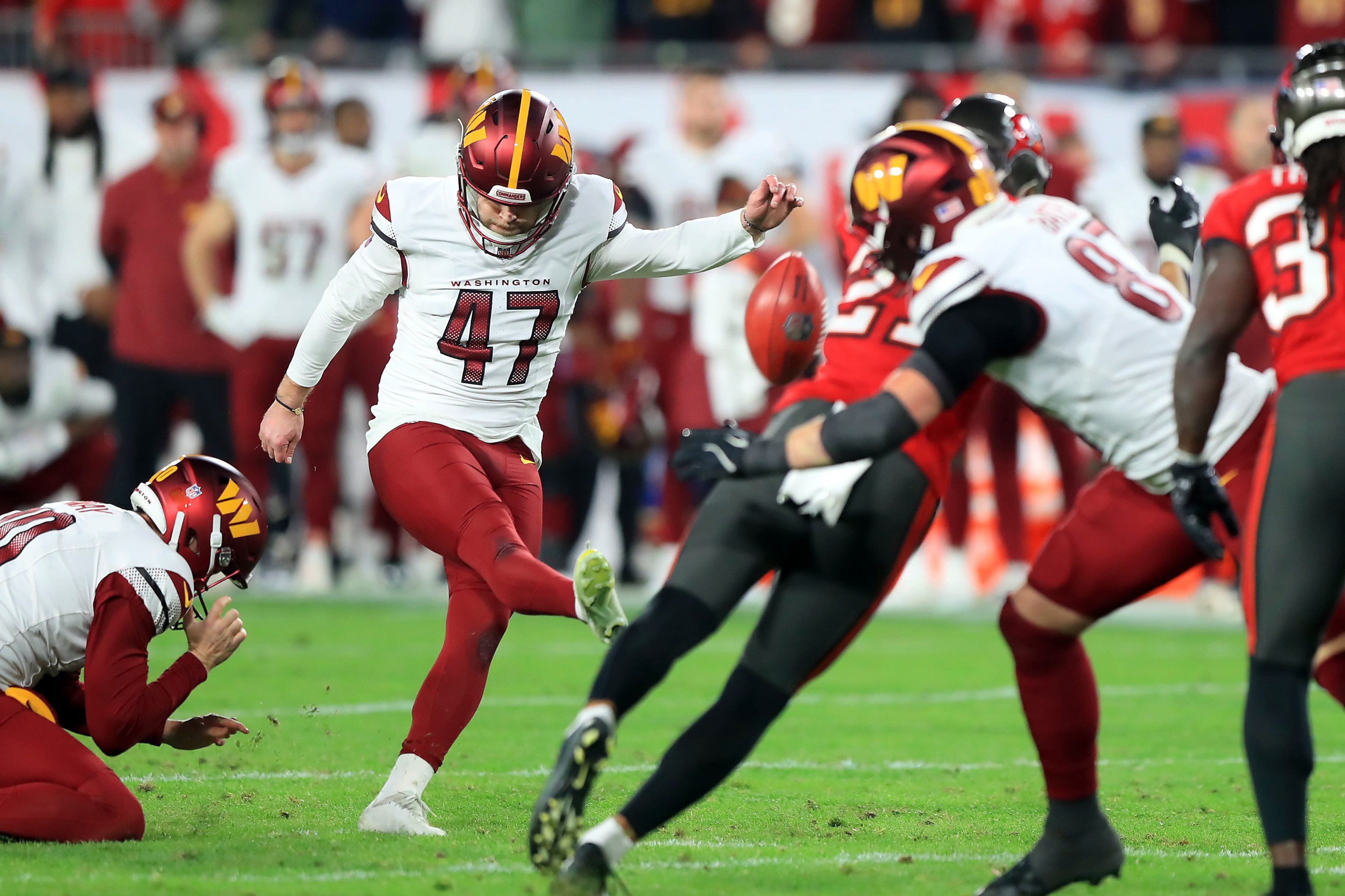 Washington Commanders Kicker Zane Gonzalez (47) kicks the game winning field goal during the NFC Wild Card Playoff game between the Washington Commanders and the Tampa Bay Buccaneers on January 12, 2025 at Raymond James Stadium in Tampa, Florida.